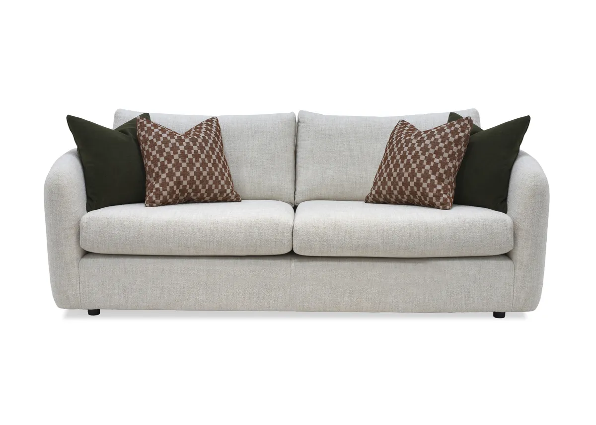 A cream boucle 3 seater sofa with 4 scatters from EZ Livings Carnaby range.Front view