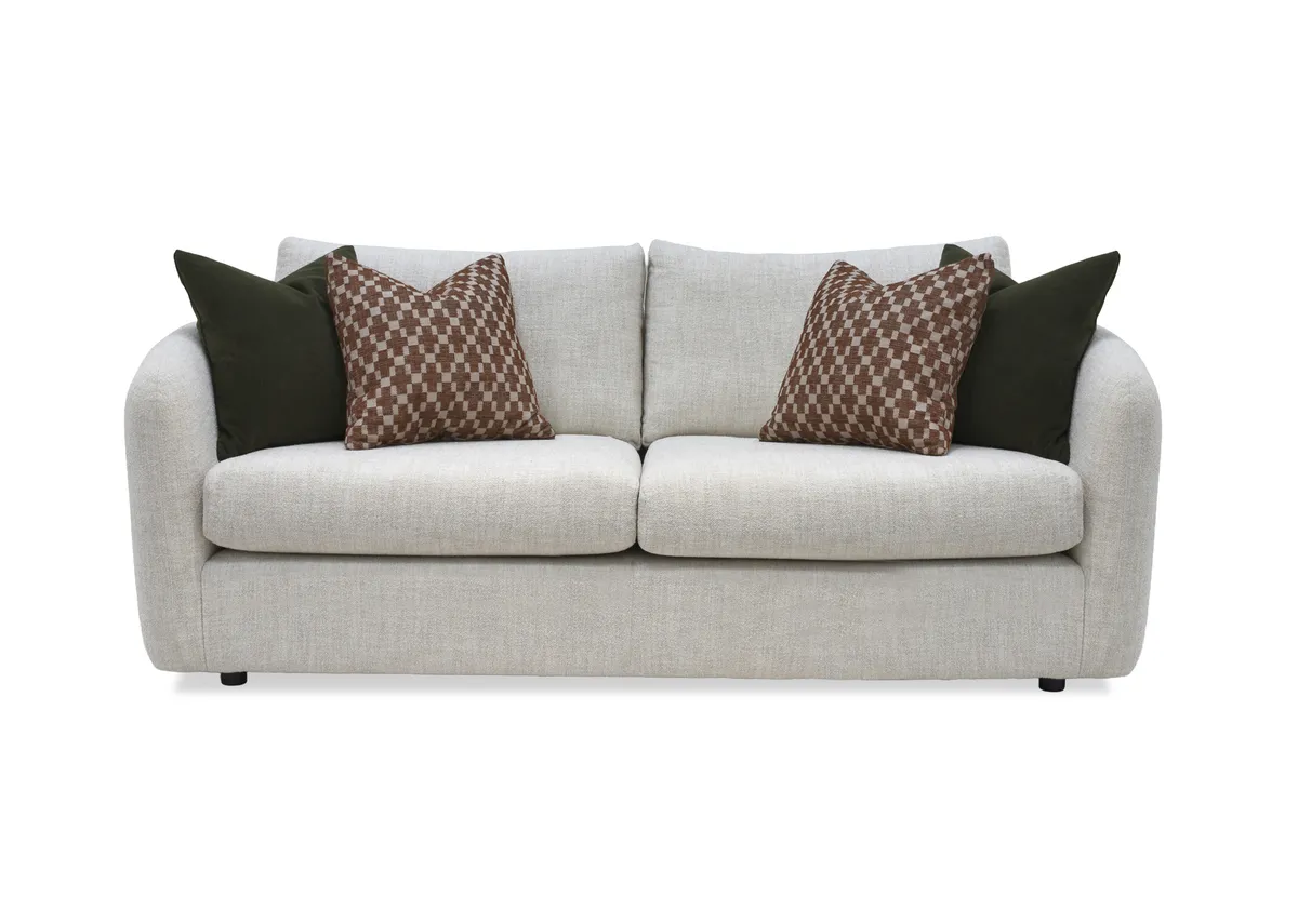 A cream boucle medium sofa with 4 scatters from EZ Livings Carnaby range.