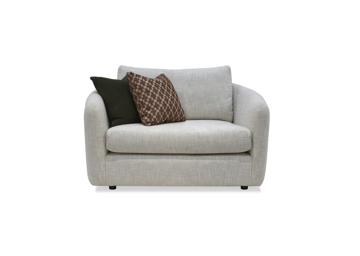 A cream boucle cuddler with 2 scatters from EZ Livings Carnaby range. Front view show thick seat cushions