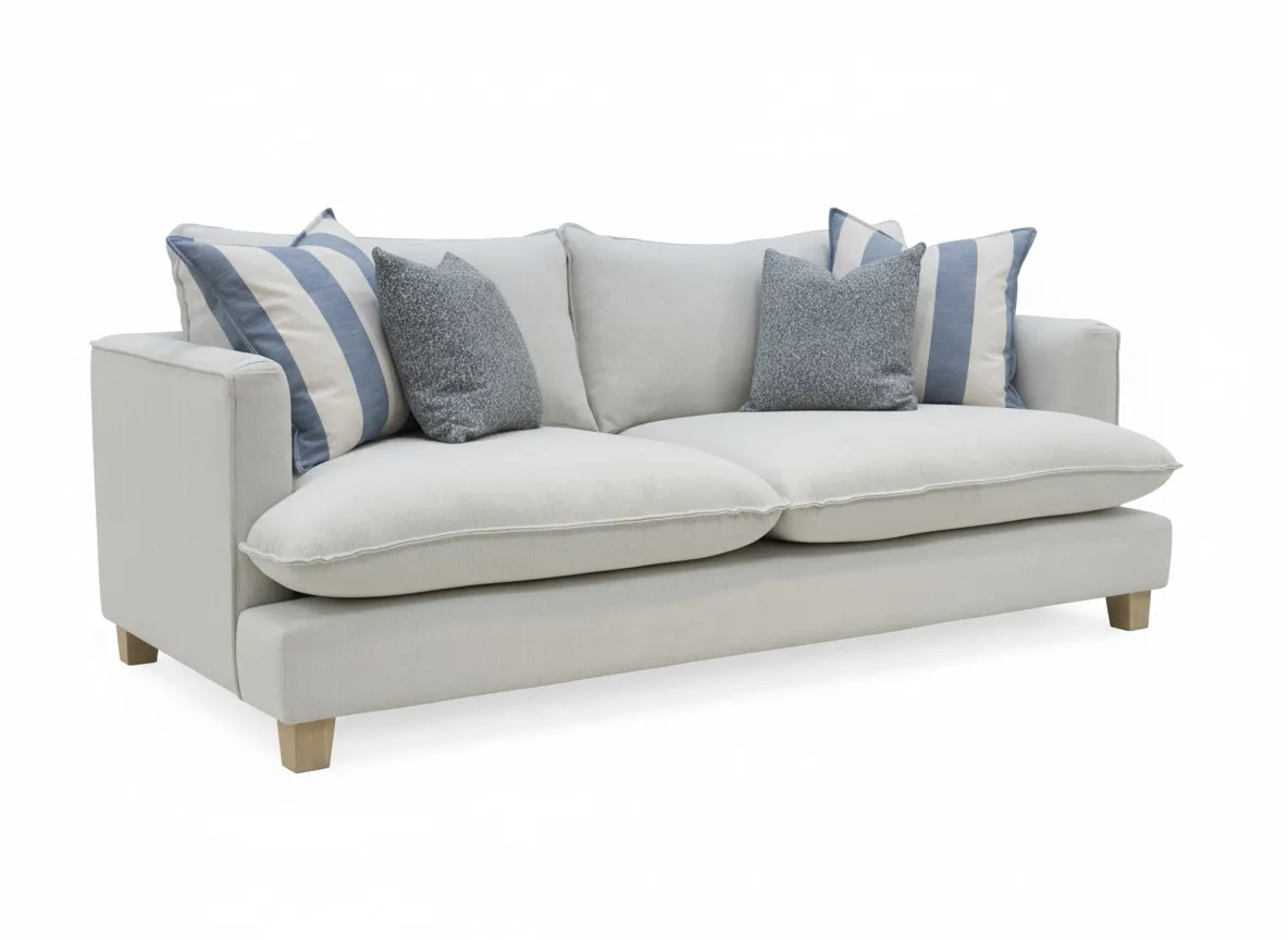 An extra large sofa with cream fabric and four scatter cushion from EZ Livings Howth range. Angled view
