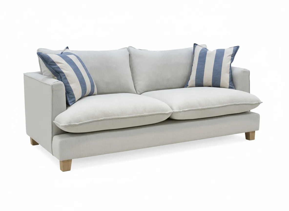 A cream 2 seater sofa from EZ Livings Howth range. Angled view of sofa with 2 stripe scatter cushions.