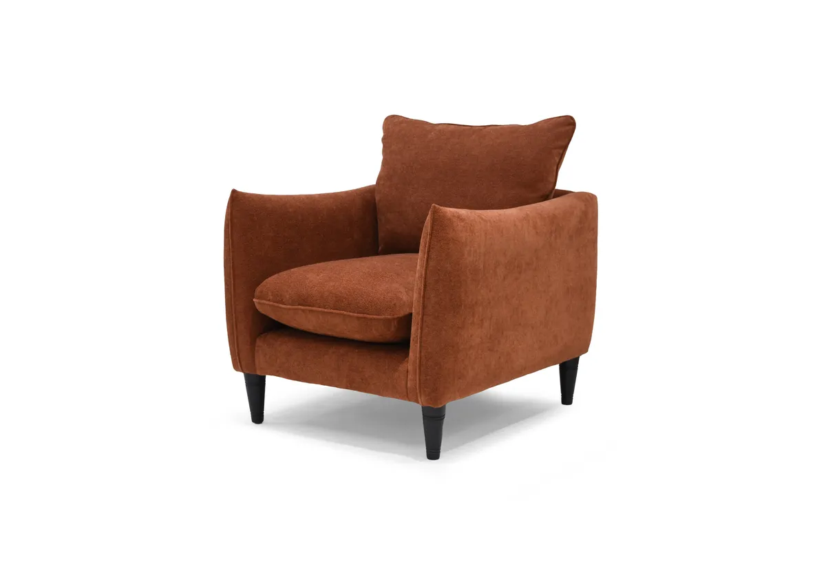 A rust boucle armchair from EZ Living Furnitures Kenmare range. Angled view.