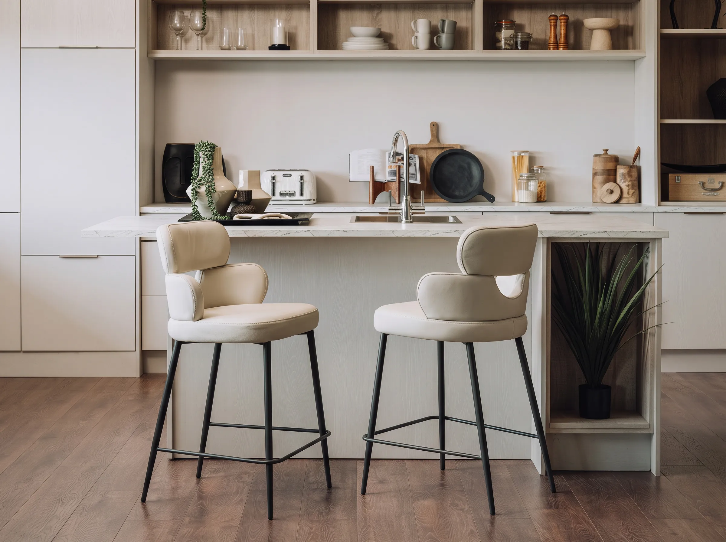 A lifestyle image of the Fusion countr stools at a kitchen island counter