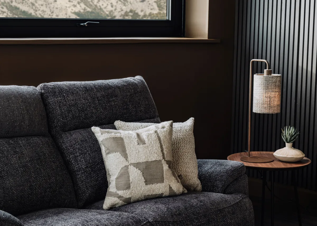 A lifestyle image of the Caoimhe corner chaise with Lila and Austen cushions