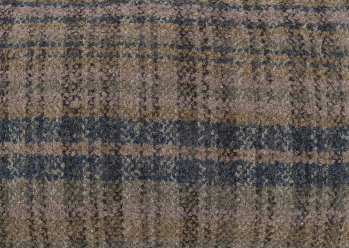 A bolster cushion with green and grey tweed from EZ Livings Uilleann range.Closeup of tweed pattern.