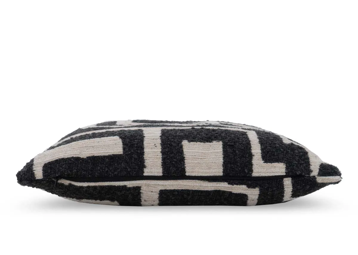 A cream cushion with dark grey maze like design from EZ Livings Zephyr range.Side view
