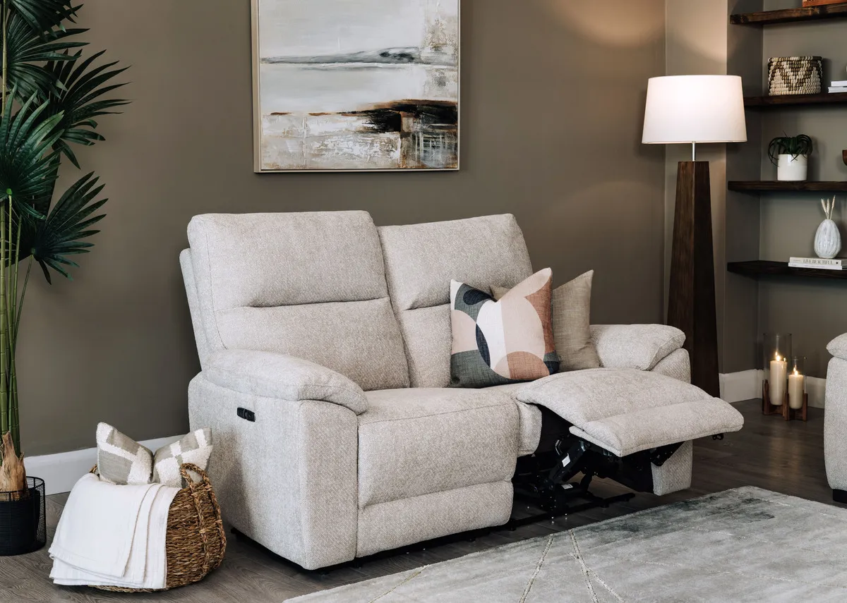 A lifestyle image of the Annalee sofa with one side reclined
