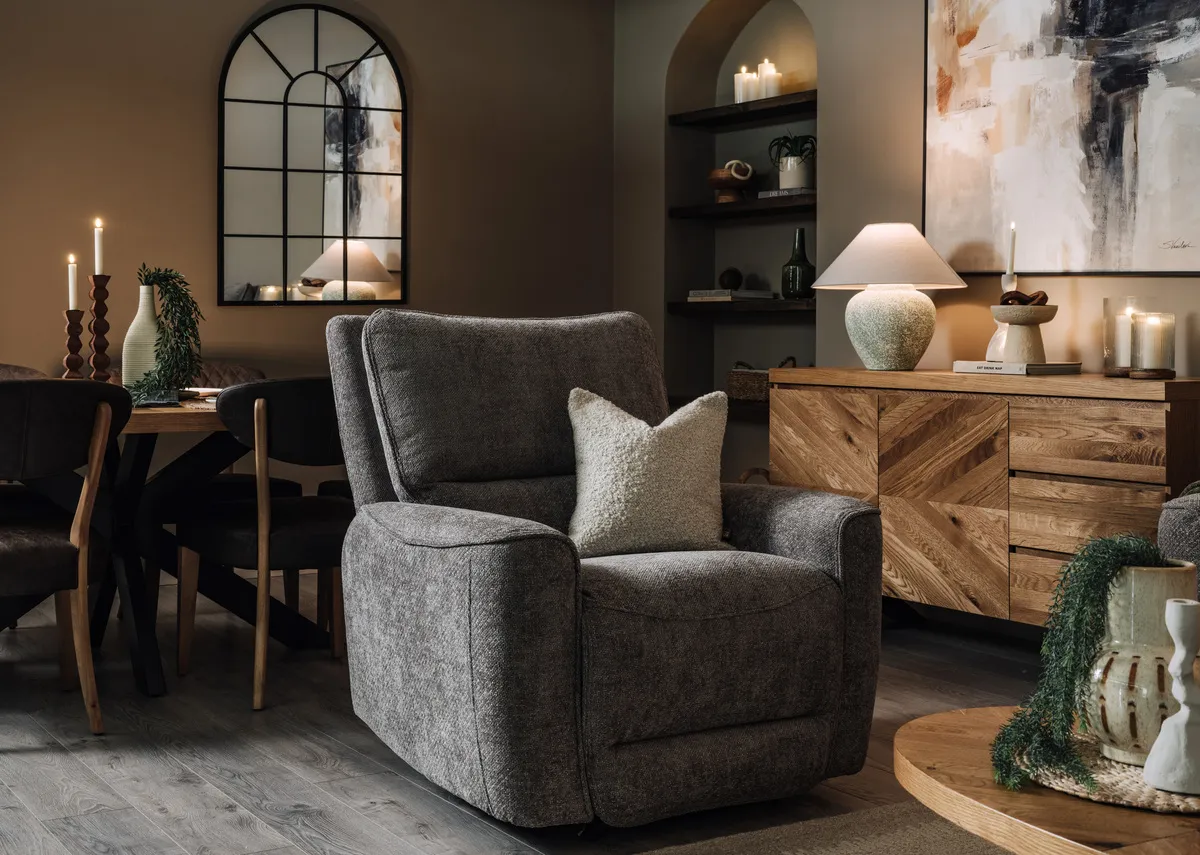 A lifestyle image of the Annalee recliner with the Ellipse sideboard