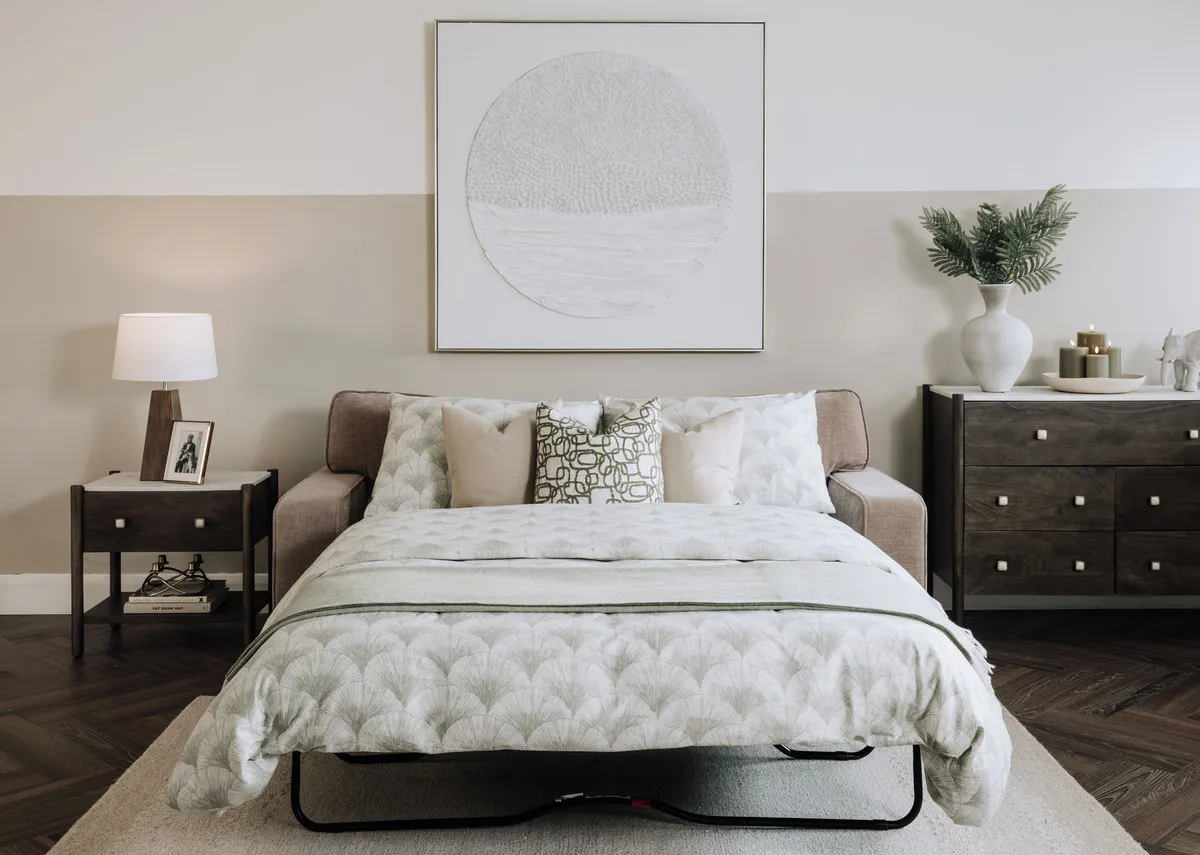 A beige fabric sofa from EZ Living Furnitures Nevada range. Side view of sofa as bed showing retractable legs