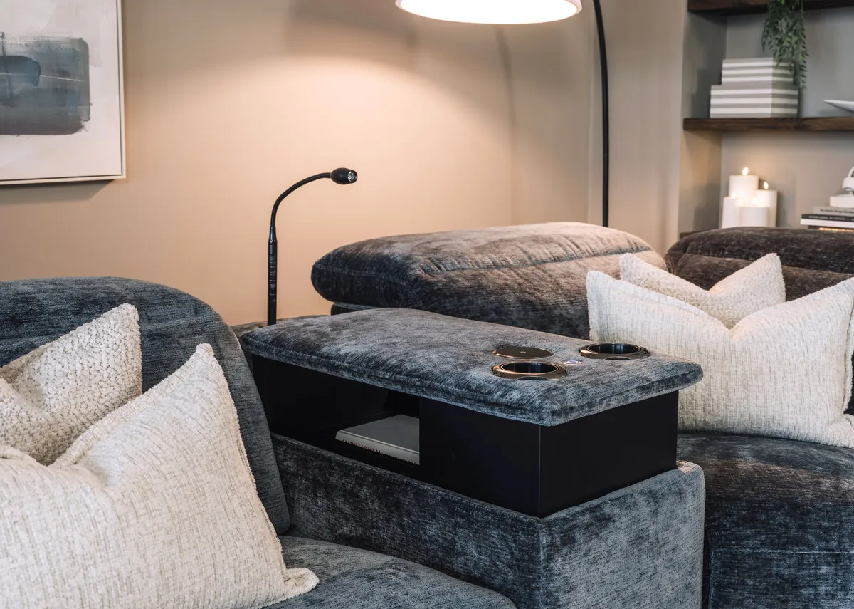 A teal fabric corner sofa with 2 seater corner and 2 seater from EZ Livings Preston range.Side view with seast fixed.
