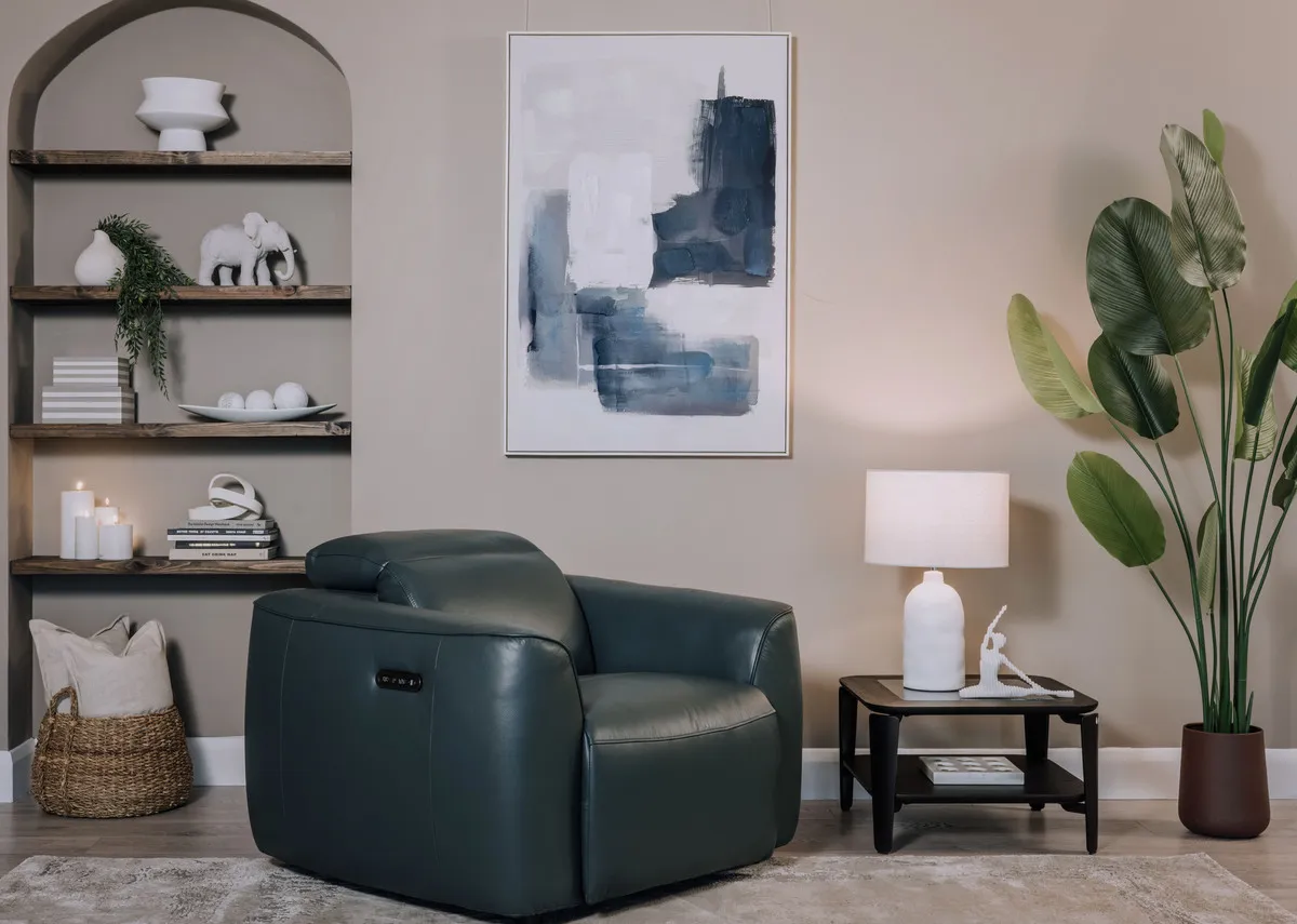 A teal leather power recliner from EZ Livings Preston range. Closeup of remote control 
