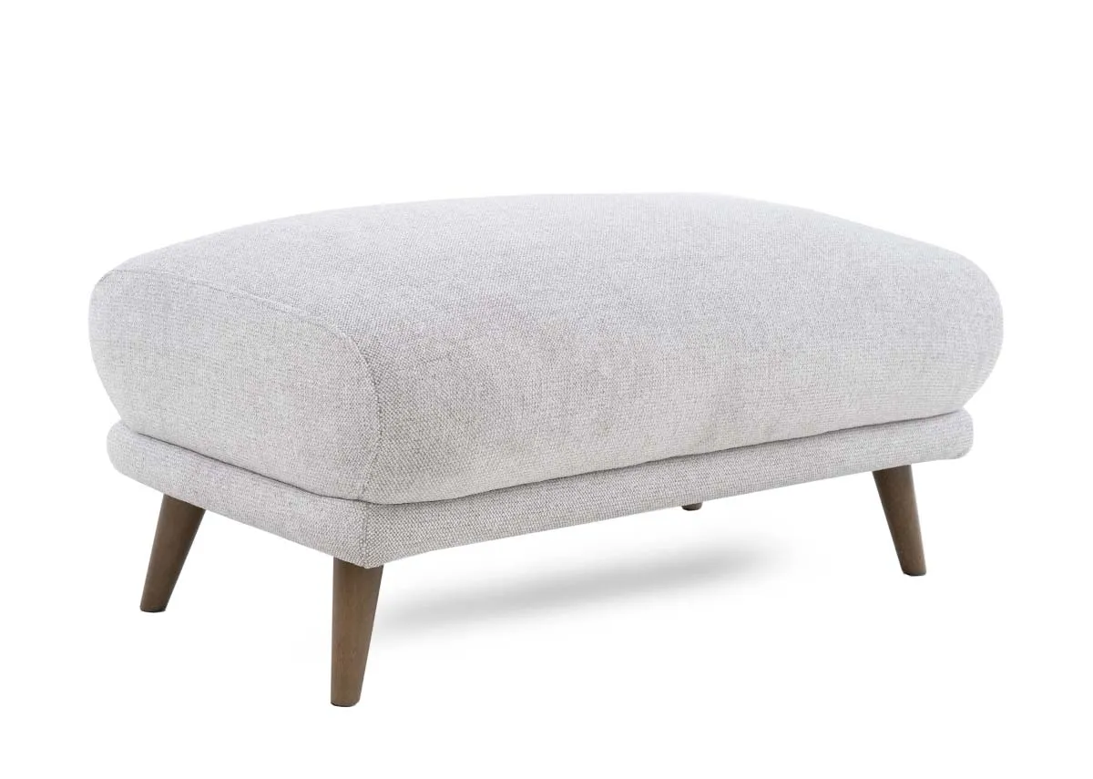 A padded footstool in a light stone fabric from EZ Livings Legend range. Angled view