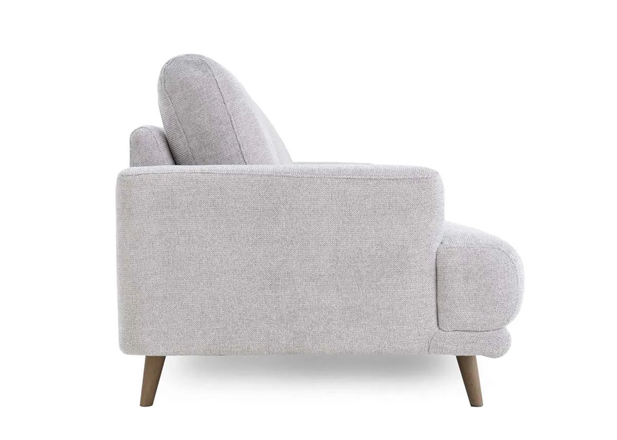 A light grey fabric armchair from EZ Livings Legend range. Side view of wide arms