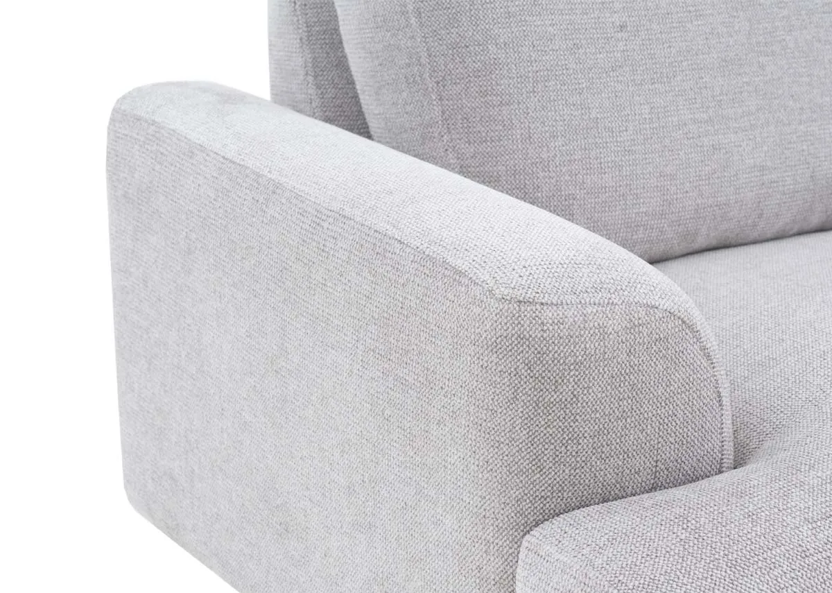 A light grey fabric armchair from EZ Livings Legend range. Closeup of padded armrests and closeup on plush fabric