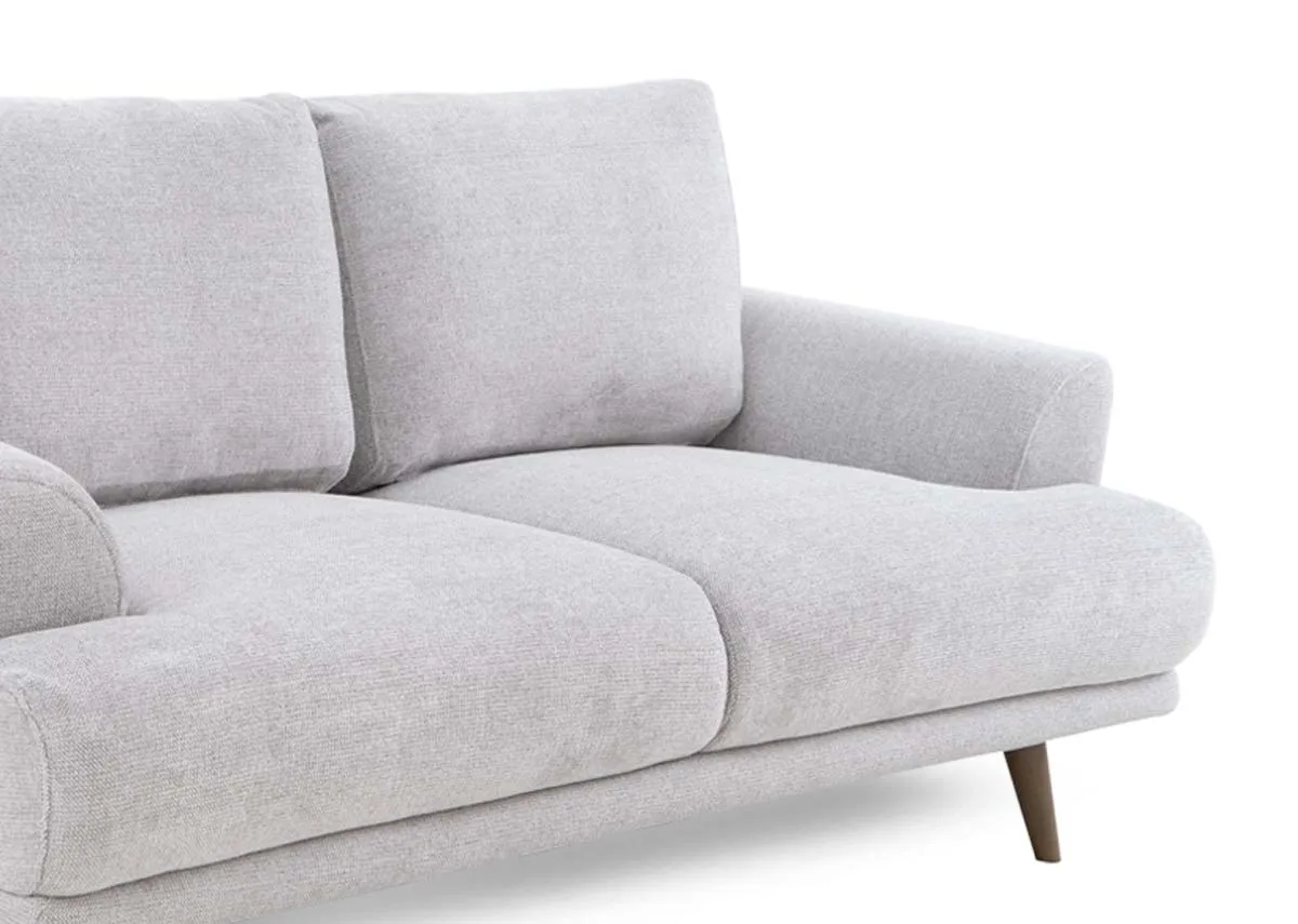 A light grey fabric 2 seater sofa from EZ Livings Legend range. Closeup of plush fabric