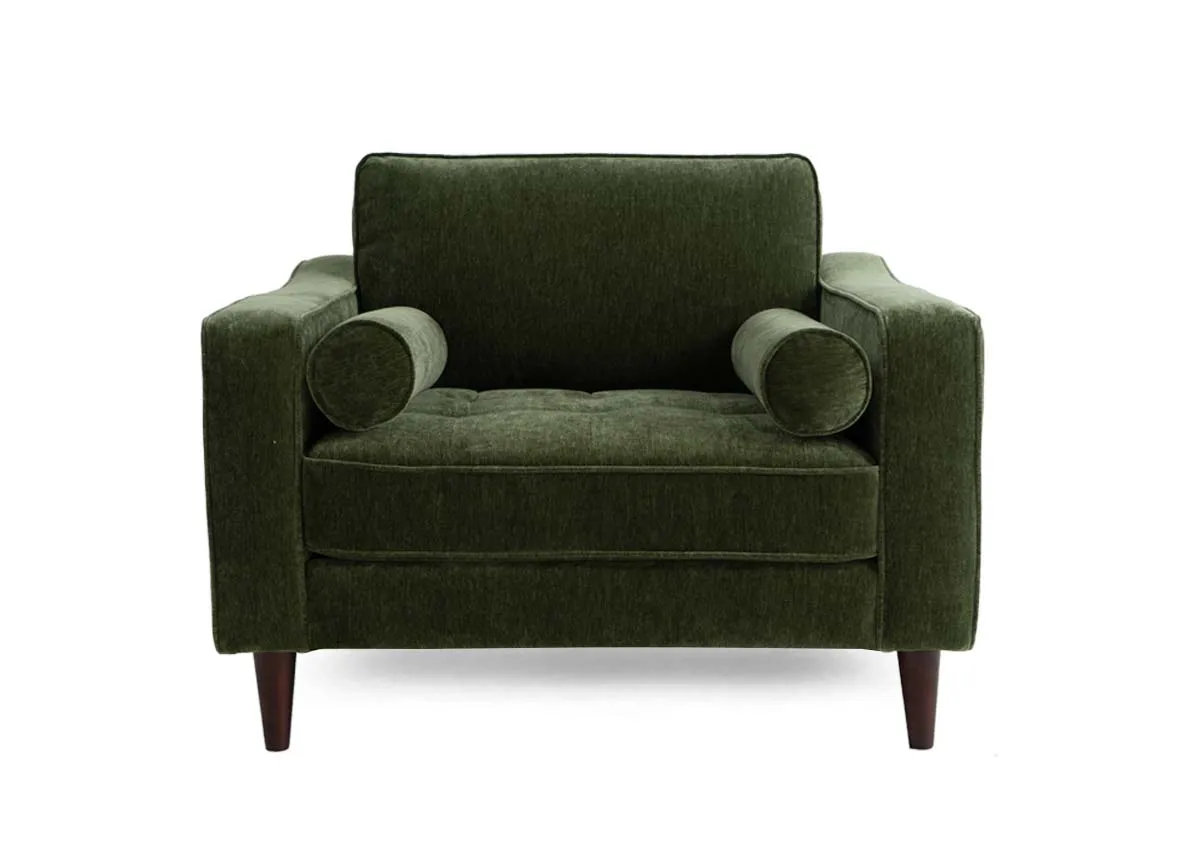A green fabric armchair from EZ Living Furniture genoa range. Closeup of the tufted button seat