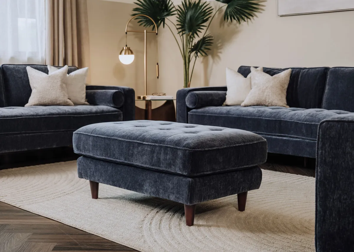 A lifetsyle image of the Genoa footstool with elio rug and Genoa sofas.