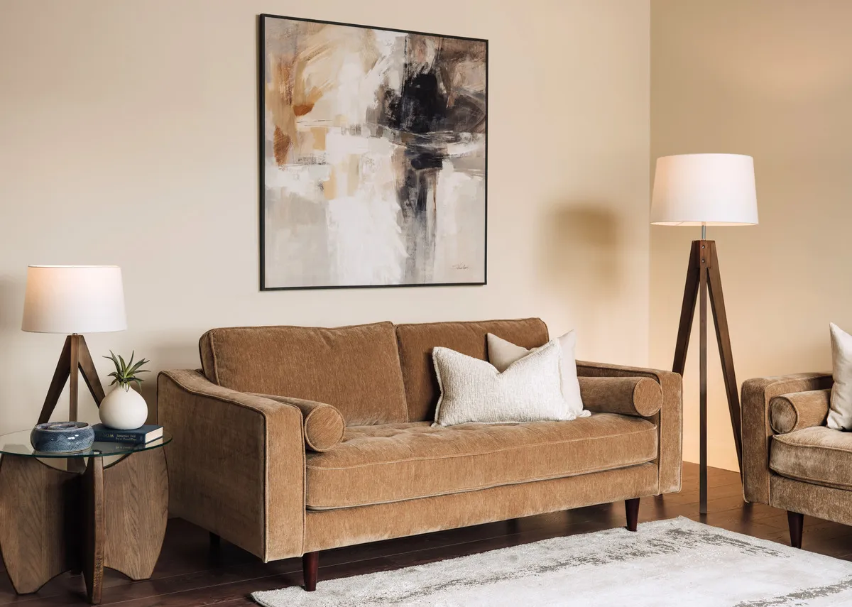 A lifestyle image of the Genoa 2 seater sofa with Evoactive print and Fauna lamps