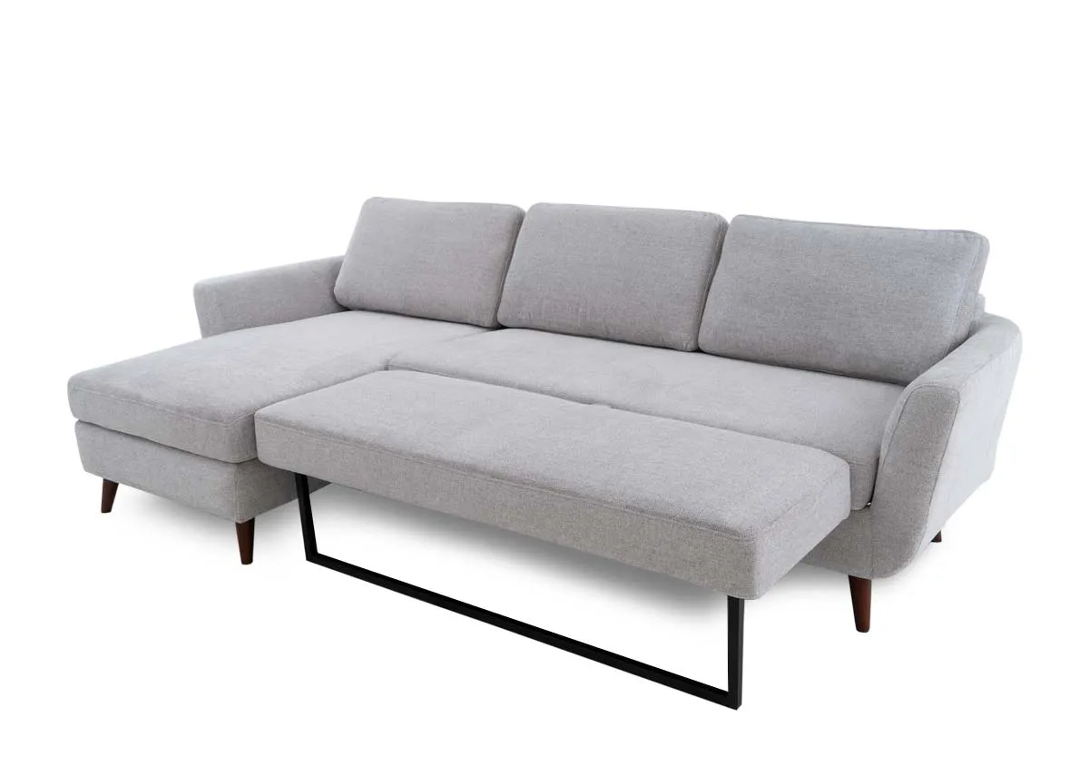 A grey fabric 3 seater sofa chaise from EZ Livings Sasha range. Side view shows walnut tapered feet