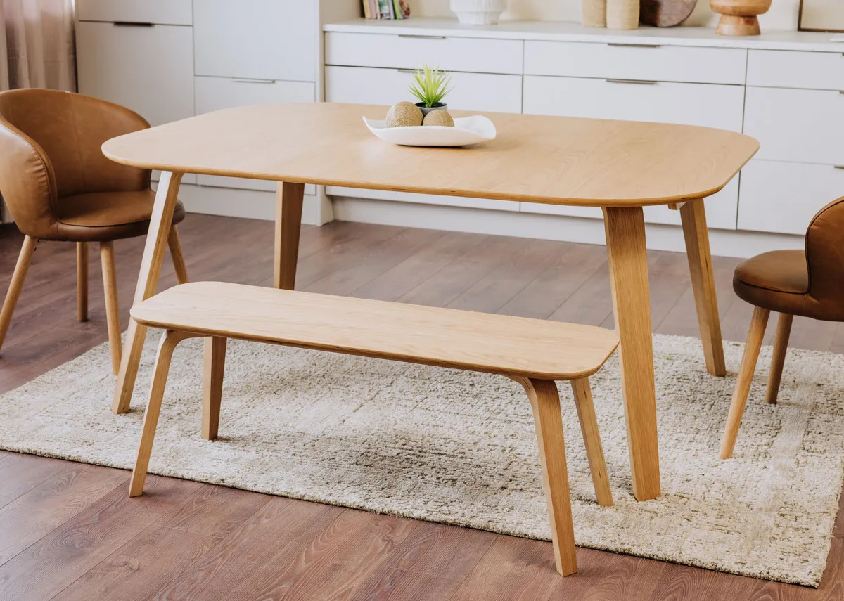 A lifestyle image of the Anton bench with matching table