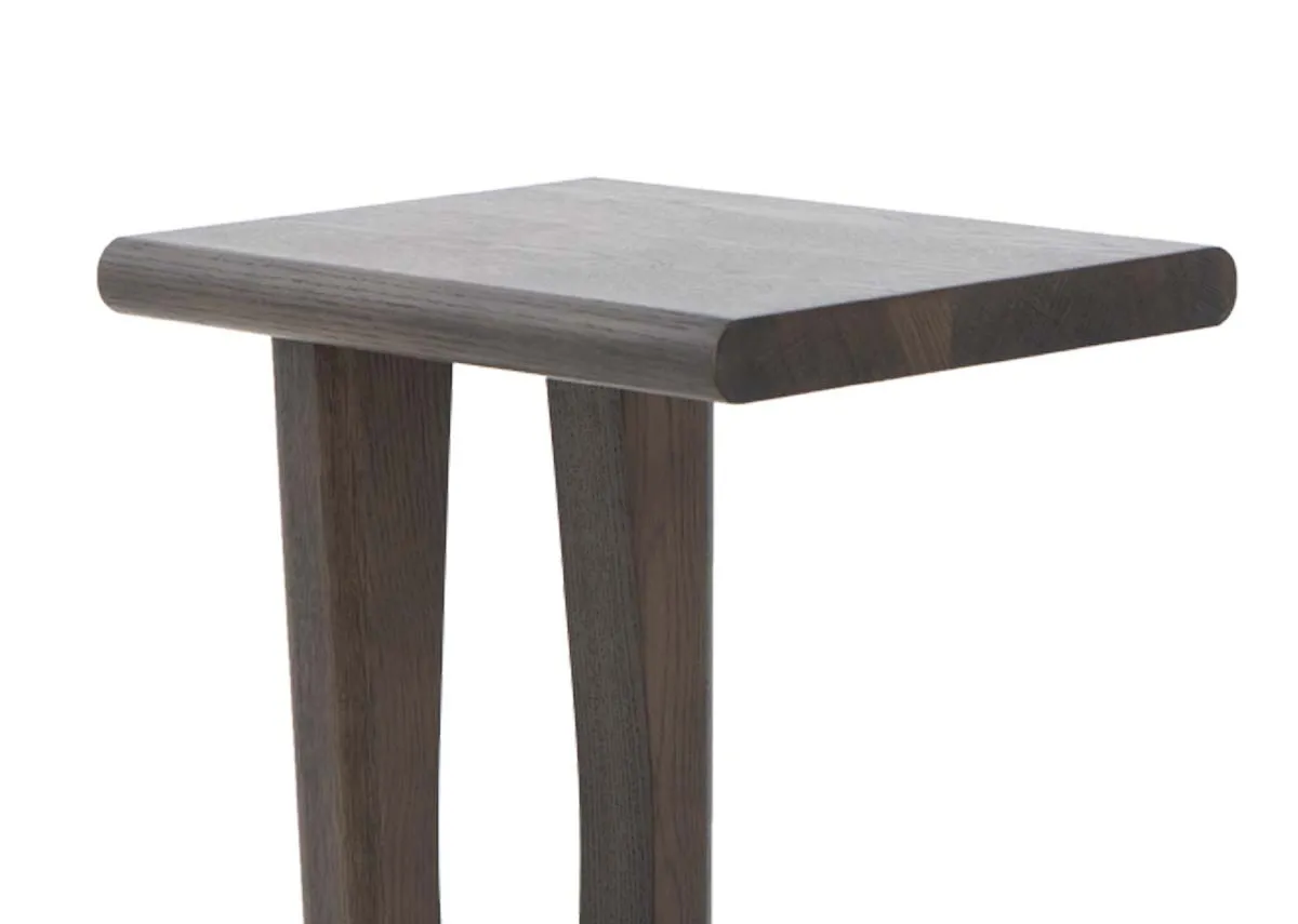 A dark oak laptop table from EZ Livings Flow range.Closeup of thick wood top with oil finish.
