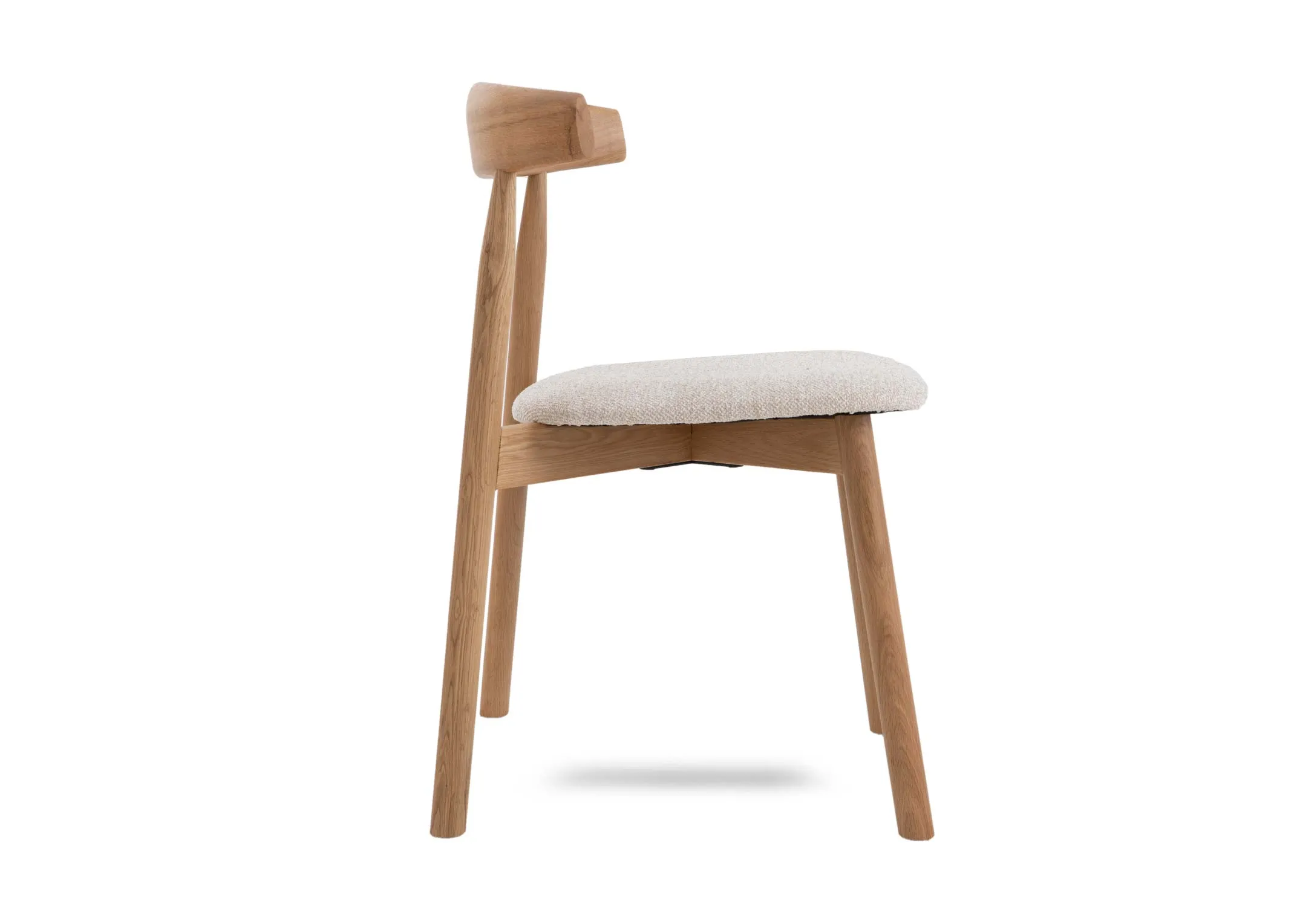 An oak dining chair with fabric seat from EZ Livings Suri range. Side view