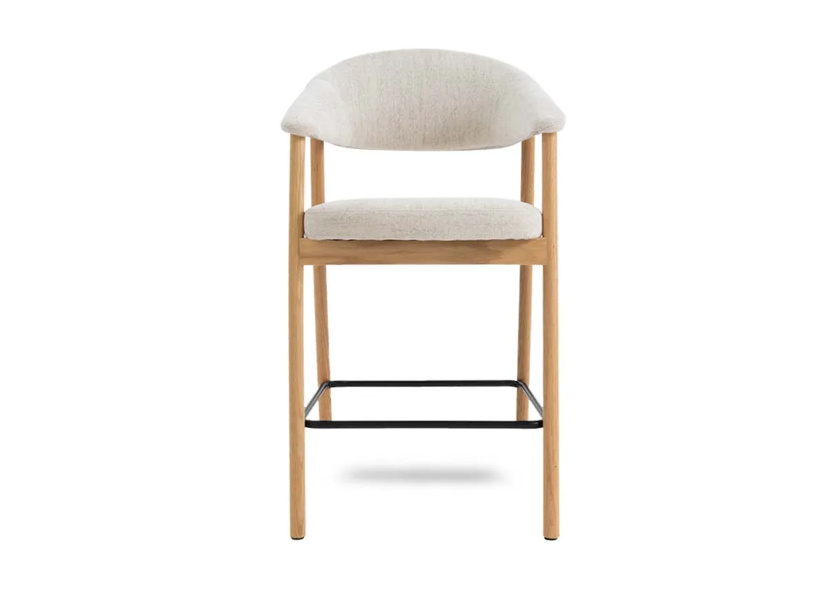 A natural oak framed counter stool with cream fabric backrest and padded seat from EZ Livings Elk range.Front view shows arched seat back