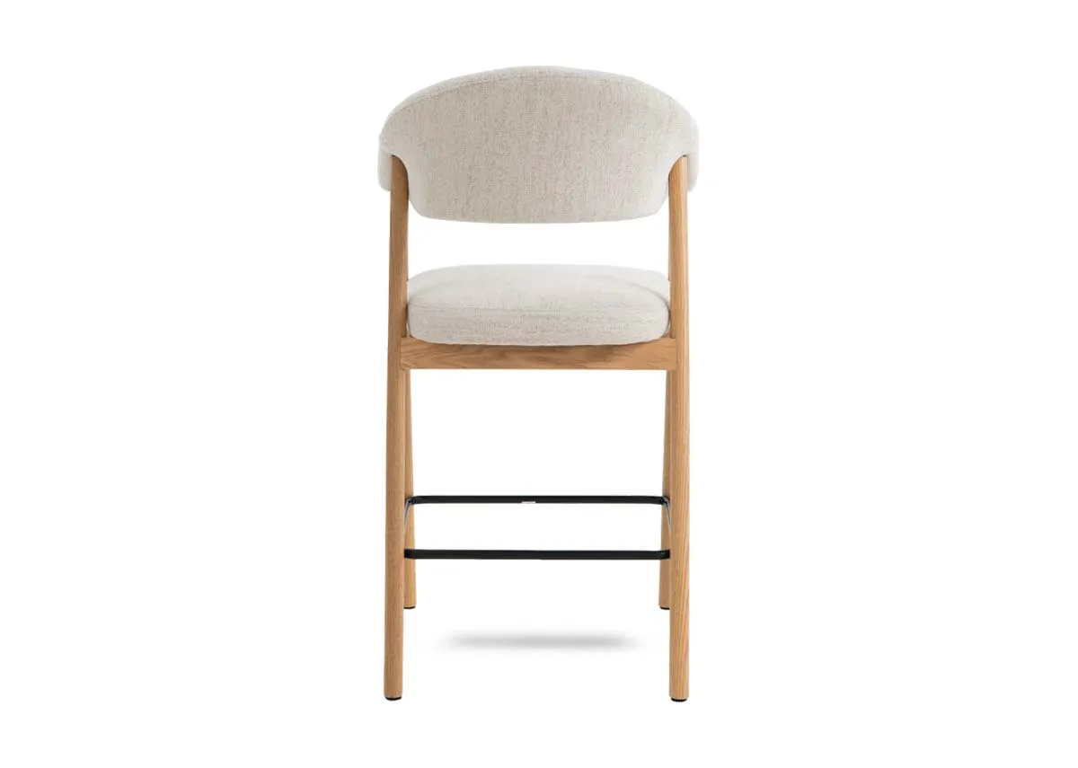 A natural oak  framed counter stool with cream fabric backrest and padded seat from EZ Livings Elk range.Back view shows high quality finish