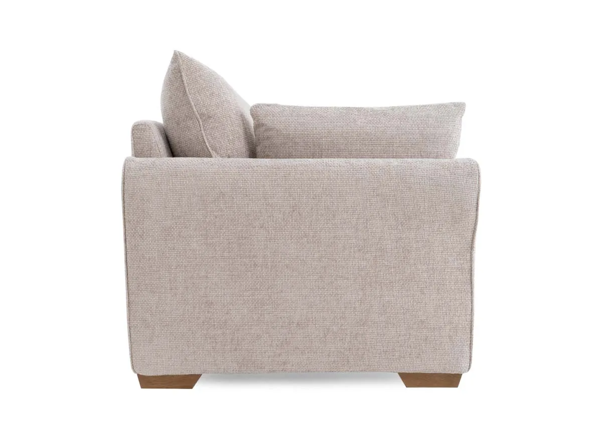 A beige fabric 3 seater sofa from EZ Livings Skyline range.Side view.