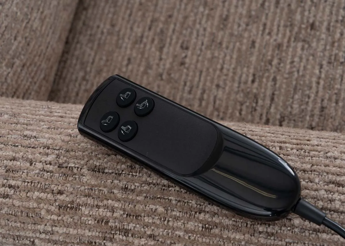 A beige fabric power recliner from EZ Livings Clyde range.Side view of chair reclined