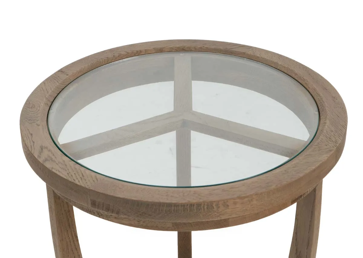 A round lamp table with oak frame and glass top from EZ Livings Alexis range. Closeup of wood frame