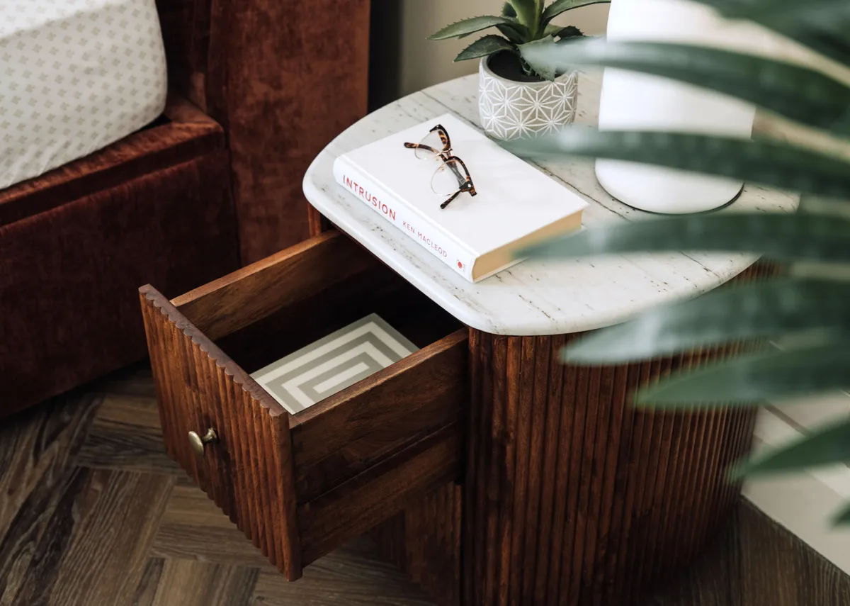 A lifestyle image of the Bunton locker with drawer open to show storage space.