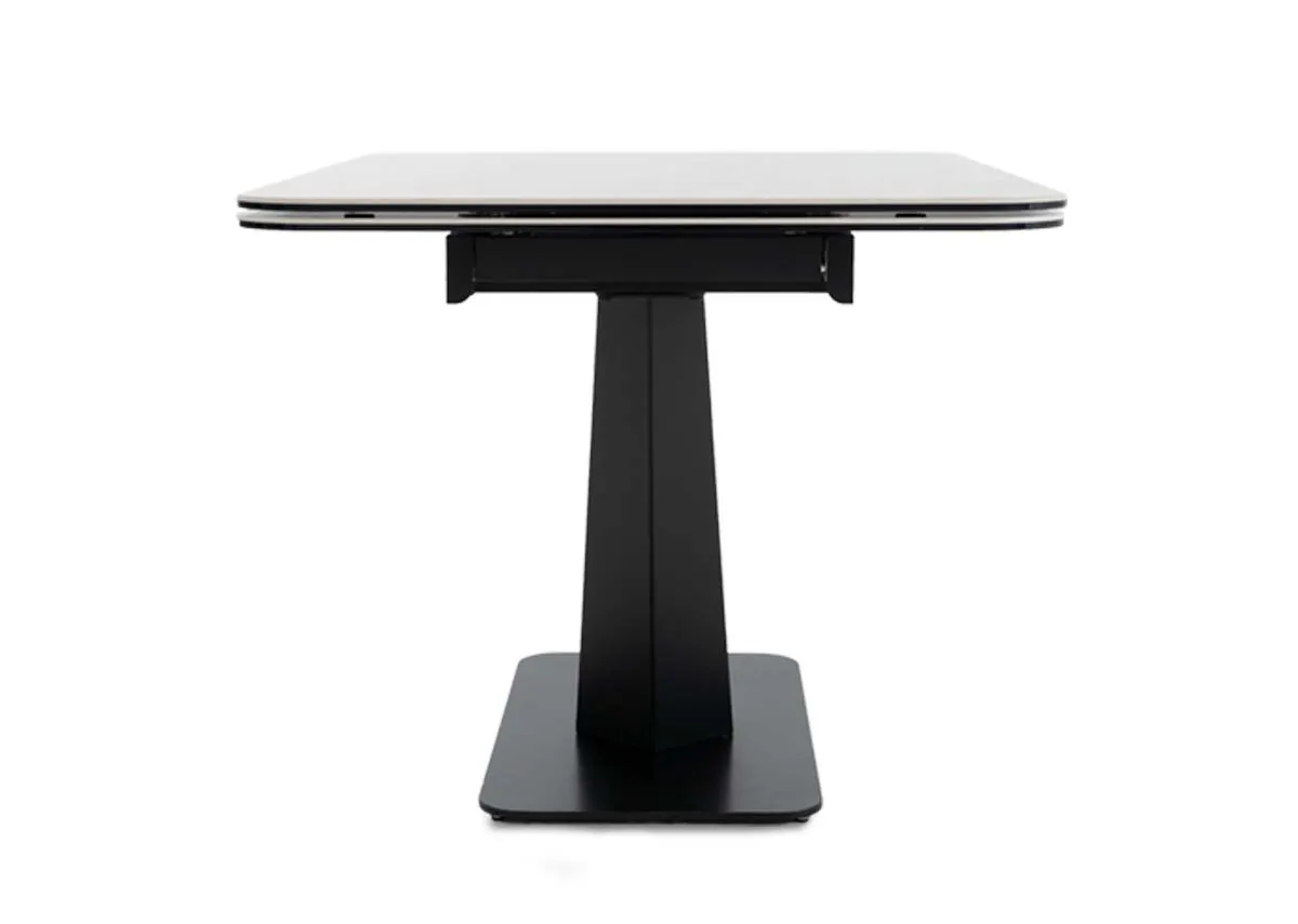 An off white cermaic top dining table from EZ Livings Tuscan range.Table side view