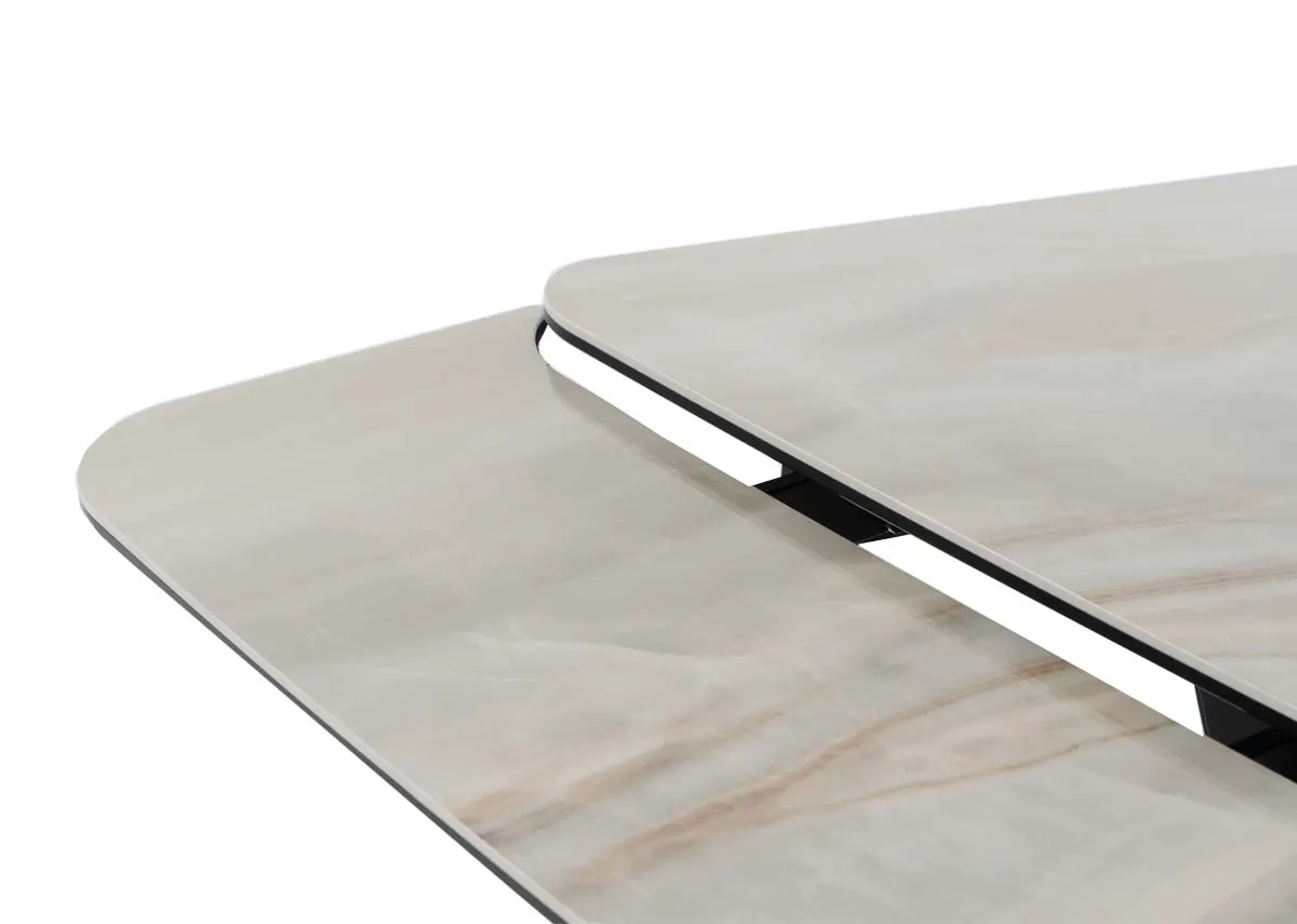An off white cermaic top dining table from EZ Livings Tuscan range. Closeup of the extension leaf