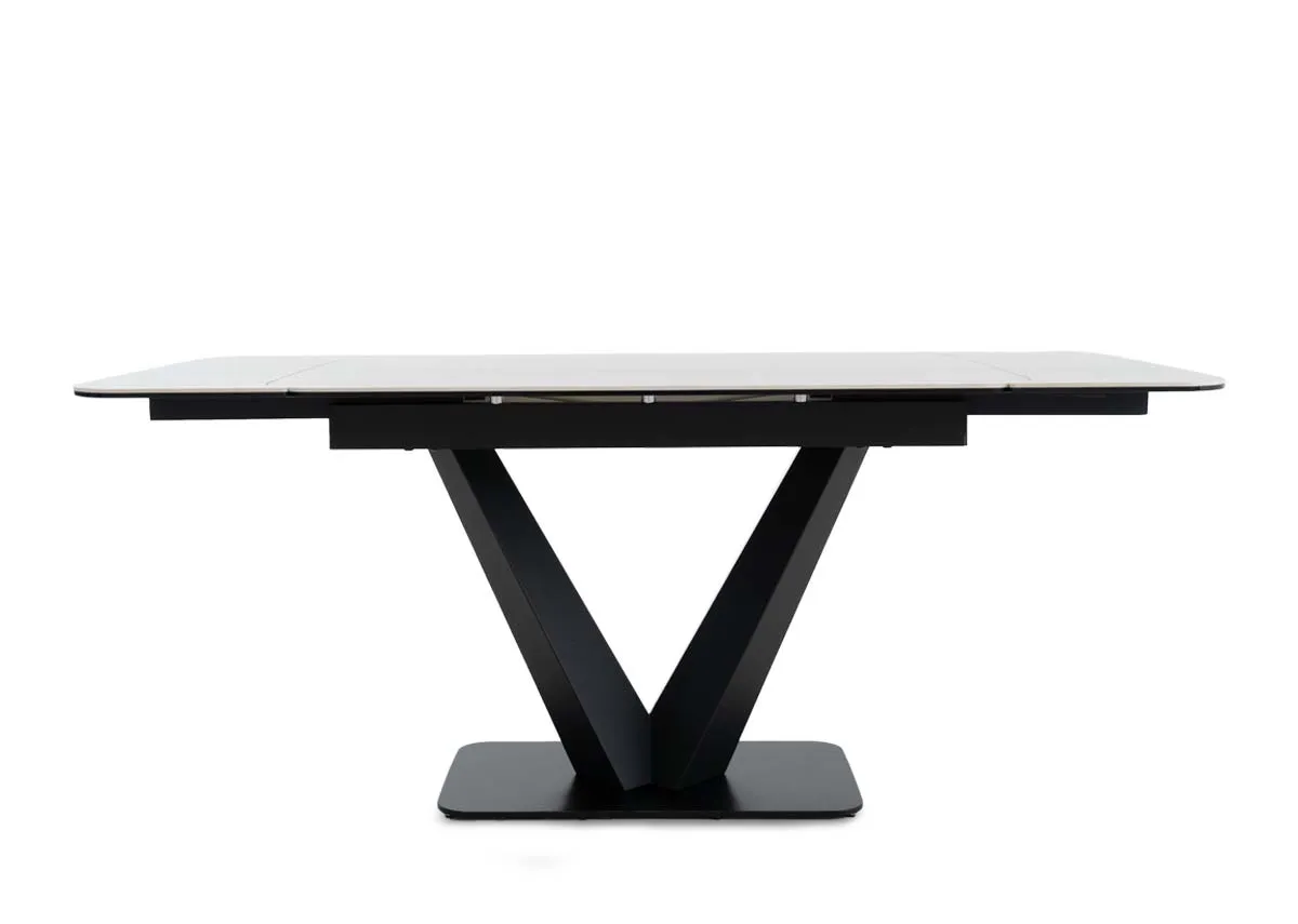 An off white cermaic top dining table from EZ Livings Tuscan range.Table extended