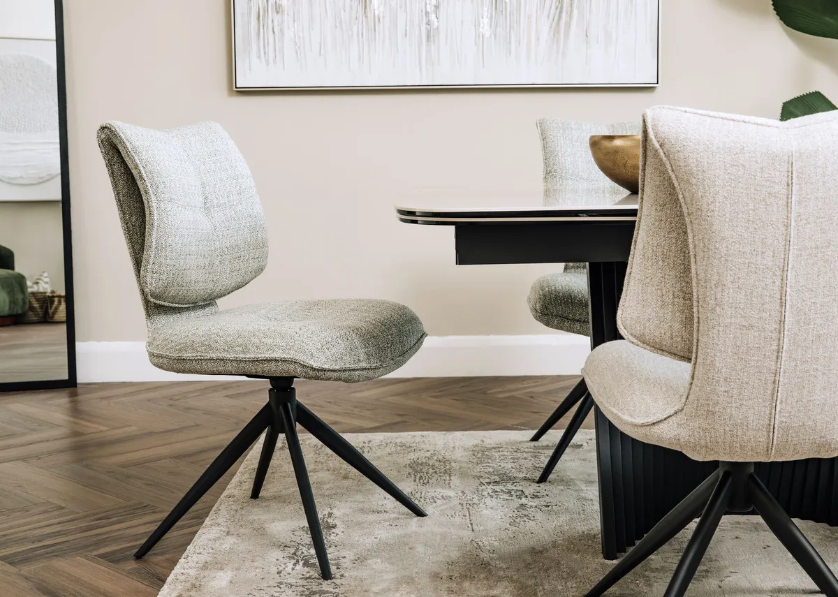 A lifestyle image of the Napoli green swivel chair with Napoli table.