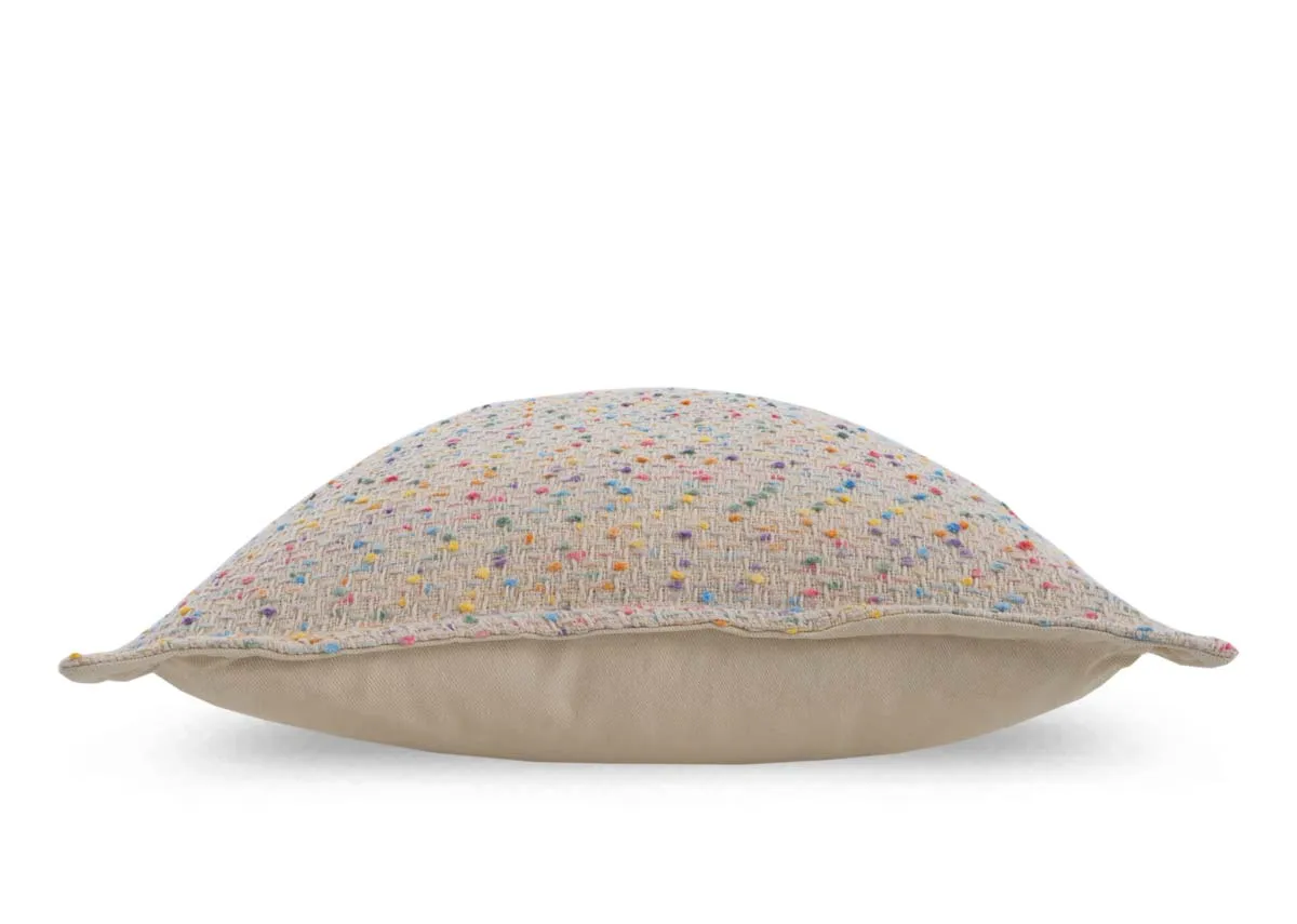 A cream cushion with multi coloured flecks from EZ Livings Honey Flax range.Side view