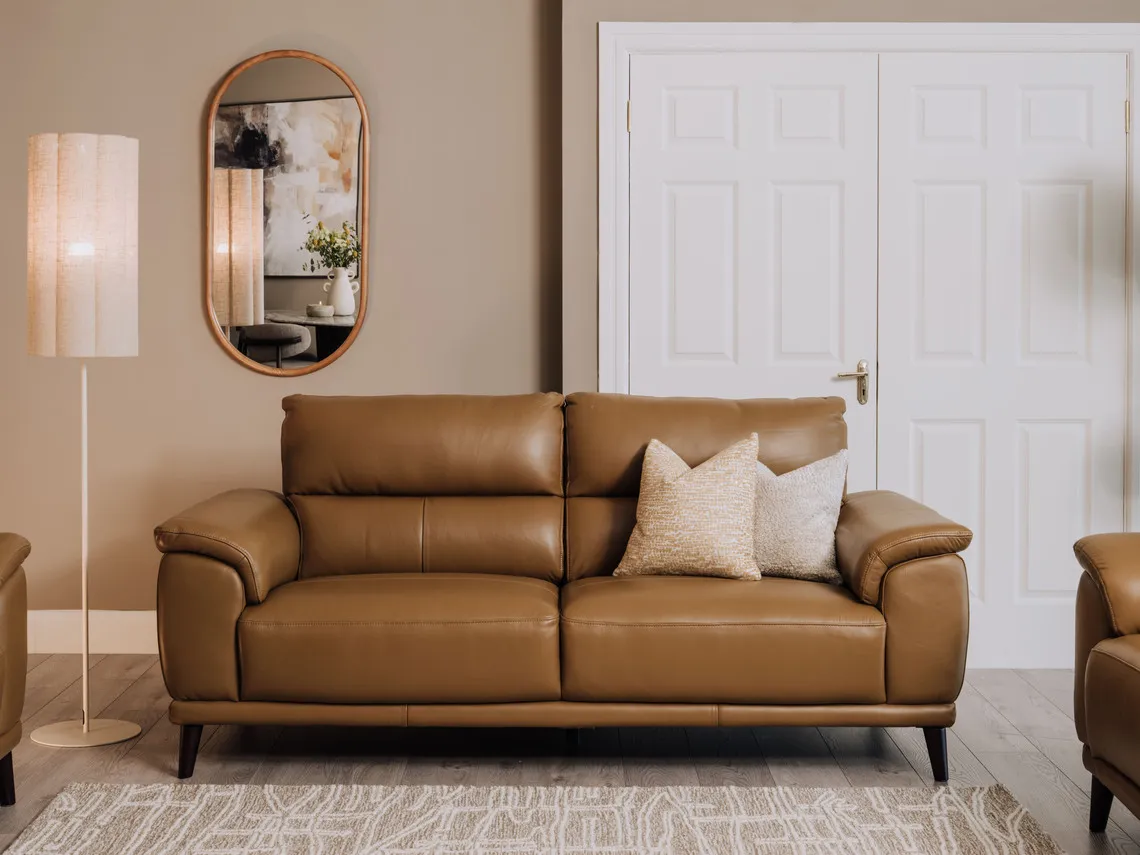 A lifestyleimage of the Savoy leather sofa with Modern meadow cushion and Carson mirror.