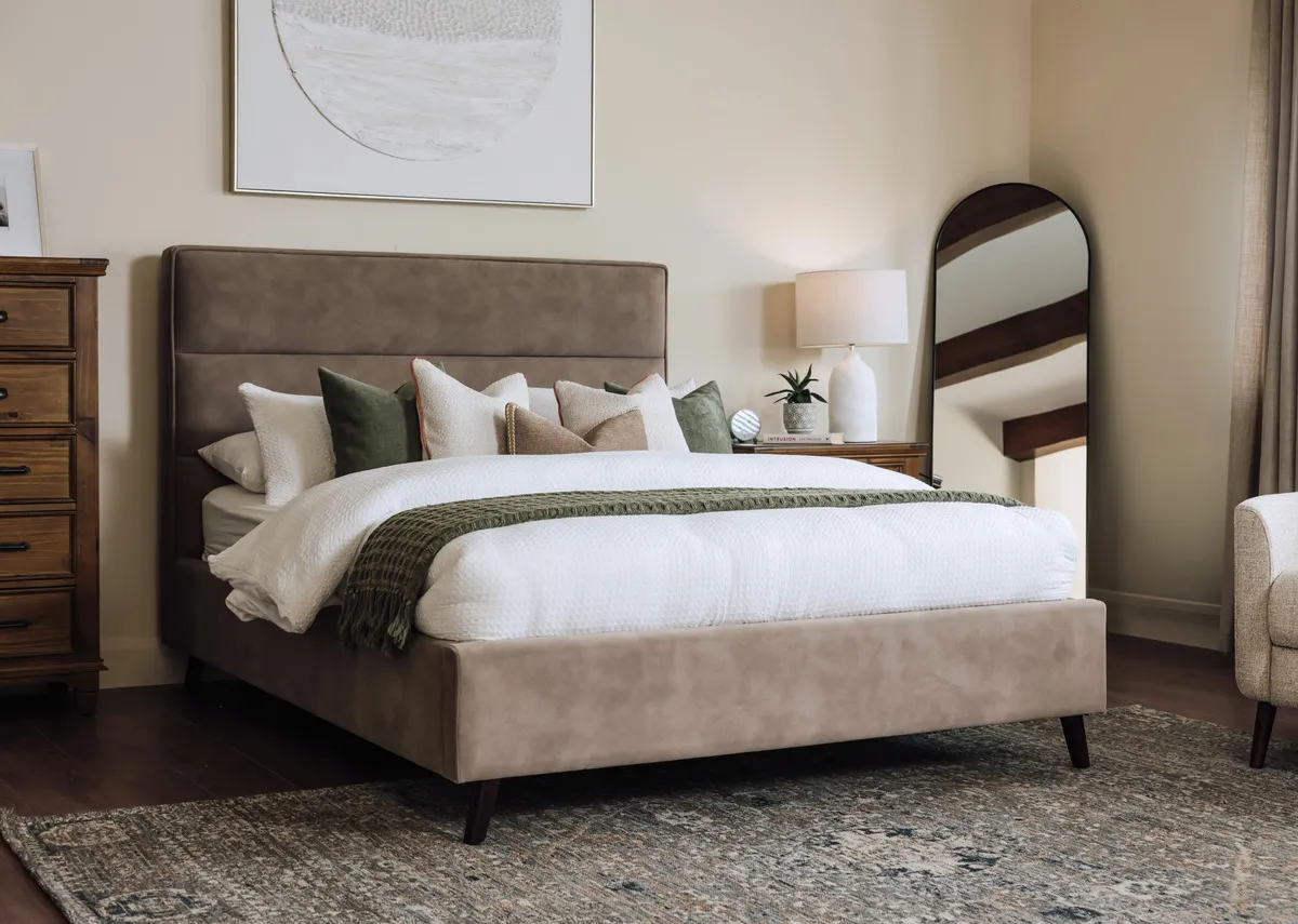 A lifetsyle image of the Ebony mocha bed with Allyson locker and chest with Pathways picture.