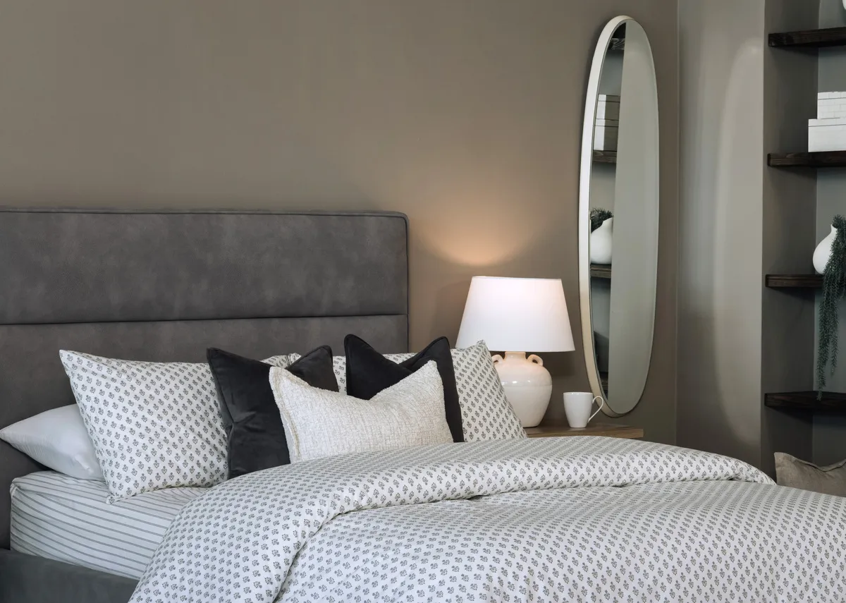 A lifestyle image of the Ebony grey headboard detail with Emma duvet set by Foxford
