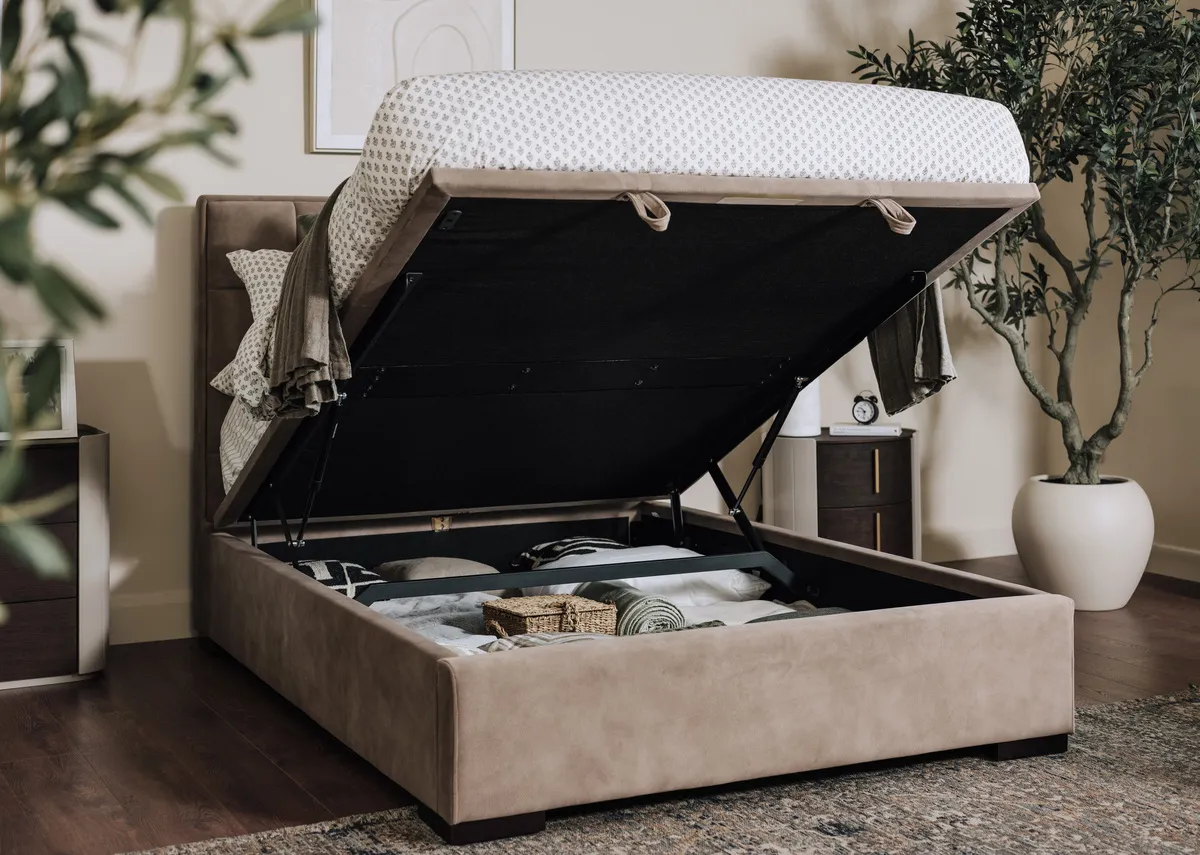 A mocha brown 5ft fabric ottoman bed from EZ Livings Sadie range.Side view of upholstered detail on sides
