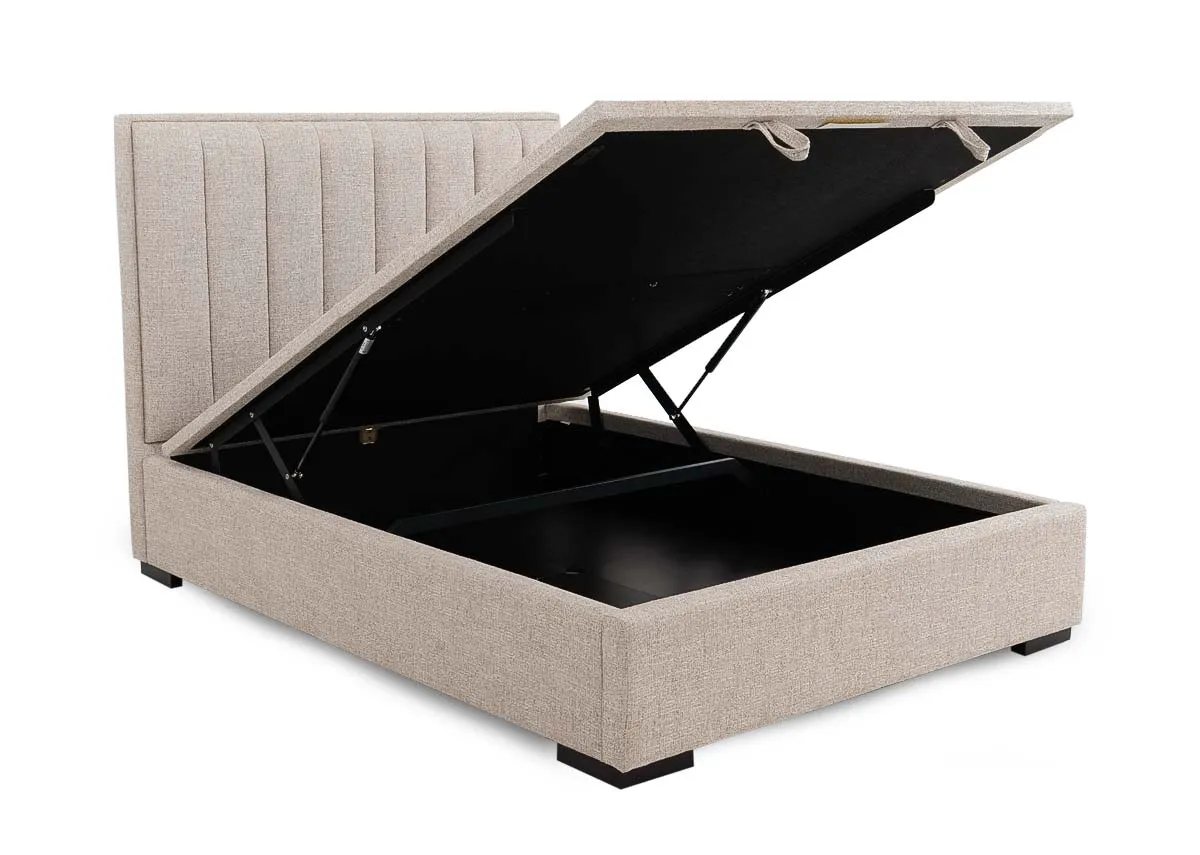 A beige fabric ottoman bed from EZ Livings Liberty range. Angled view of base lifted to reveal storage space