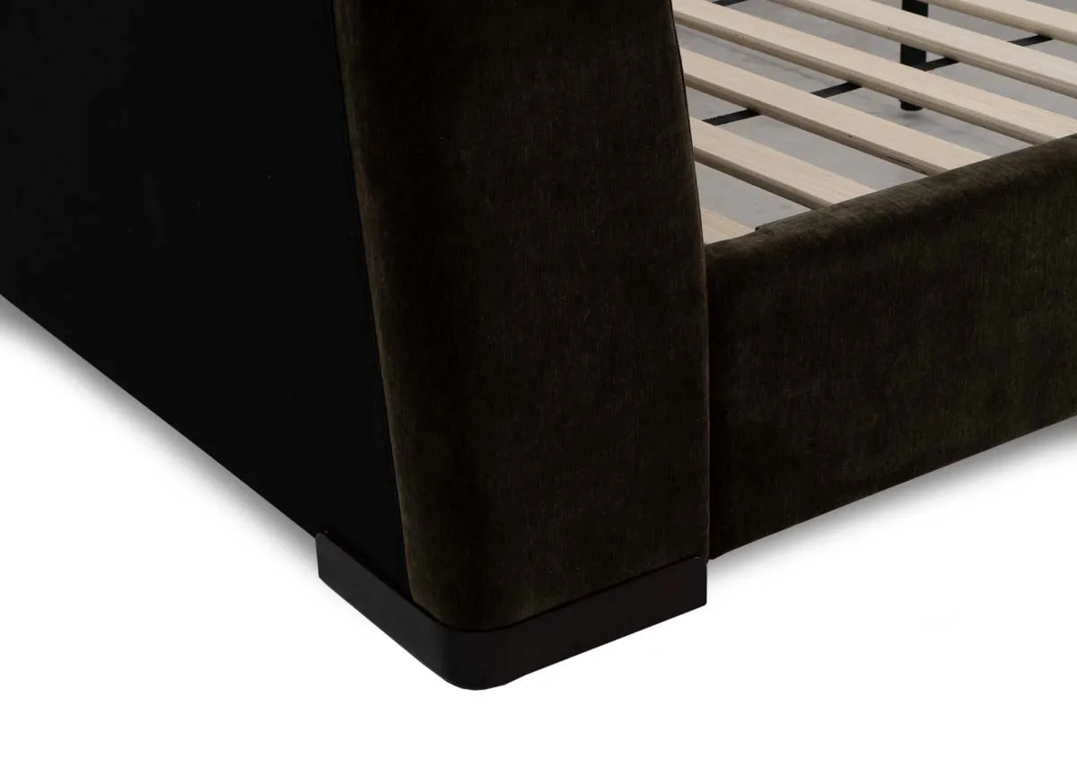 A green fabric bedframe with padded headboard from EZ Livings Comfy range.Side view of upholstered finish on base