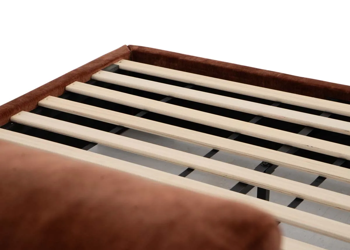 A rust fabric bedframe with high pillowback headboard from EZ Livings Comfy range. Closeup of slat wood base.
