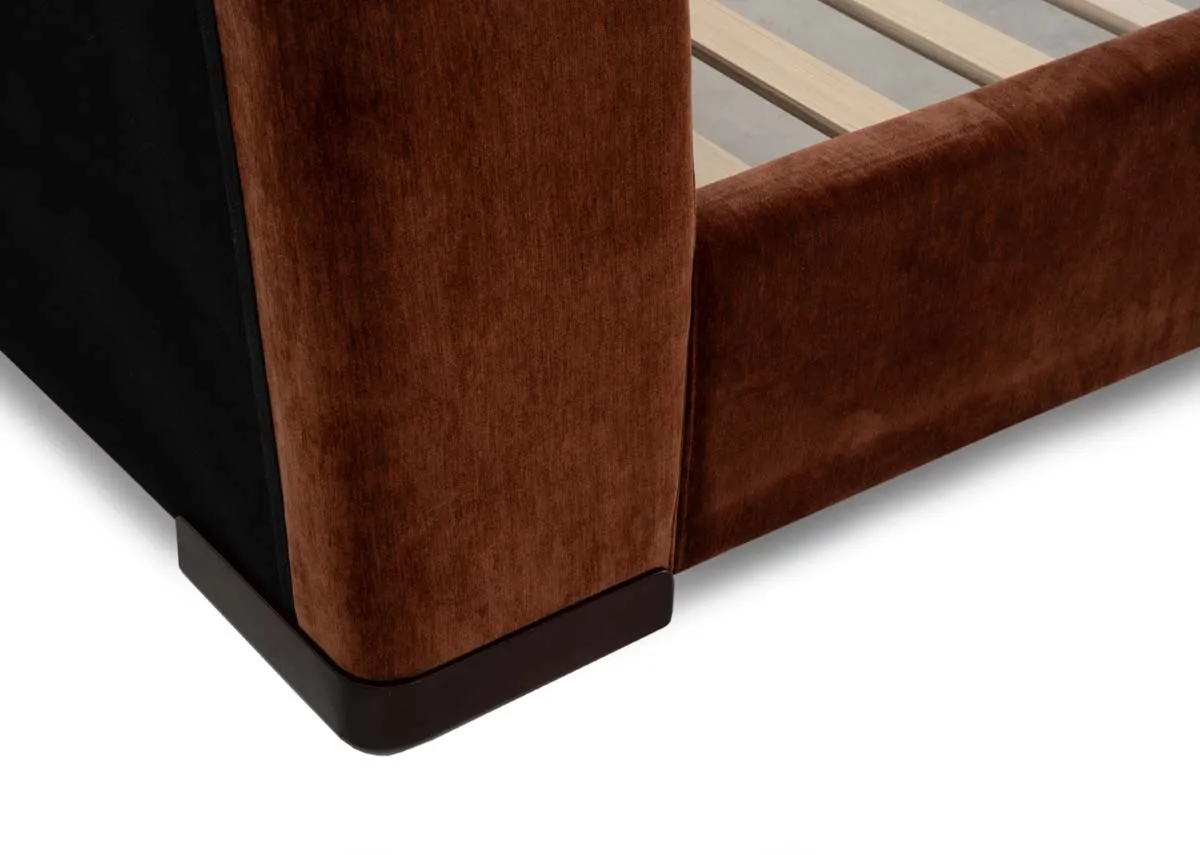 A rust fabric bedframe with a closeup on the upholstered sides and frame.