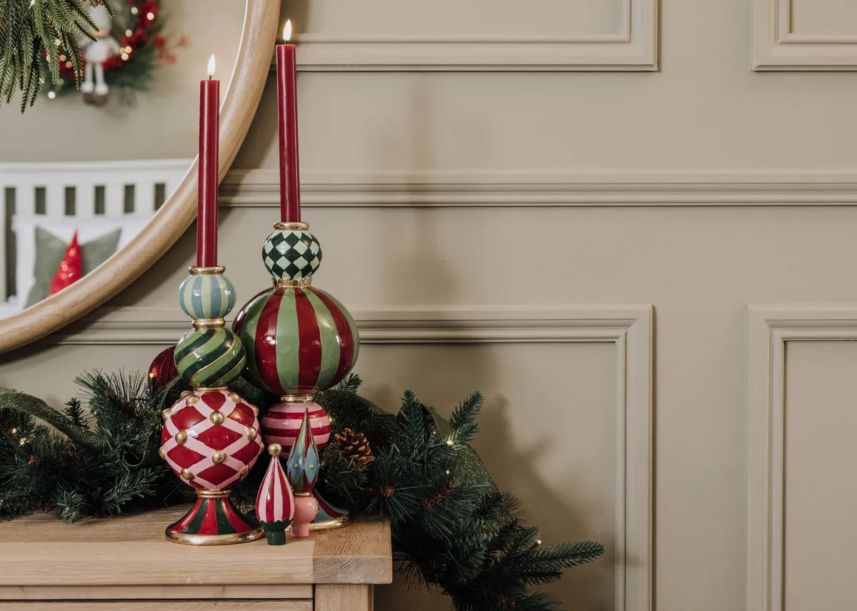 A set of large and small pinnacle decorations on the Albany sideboard.