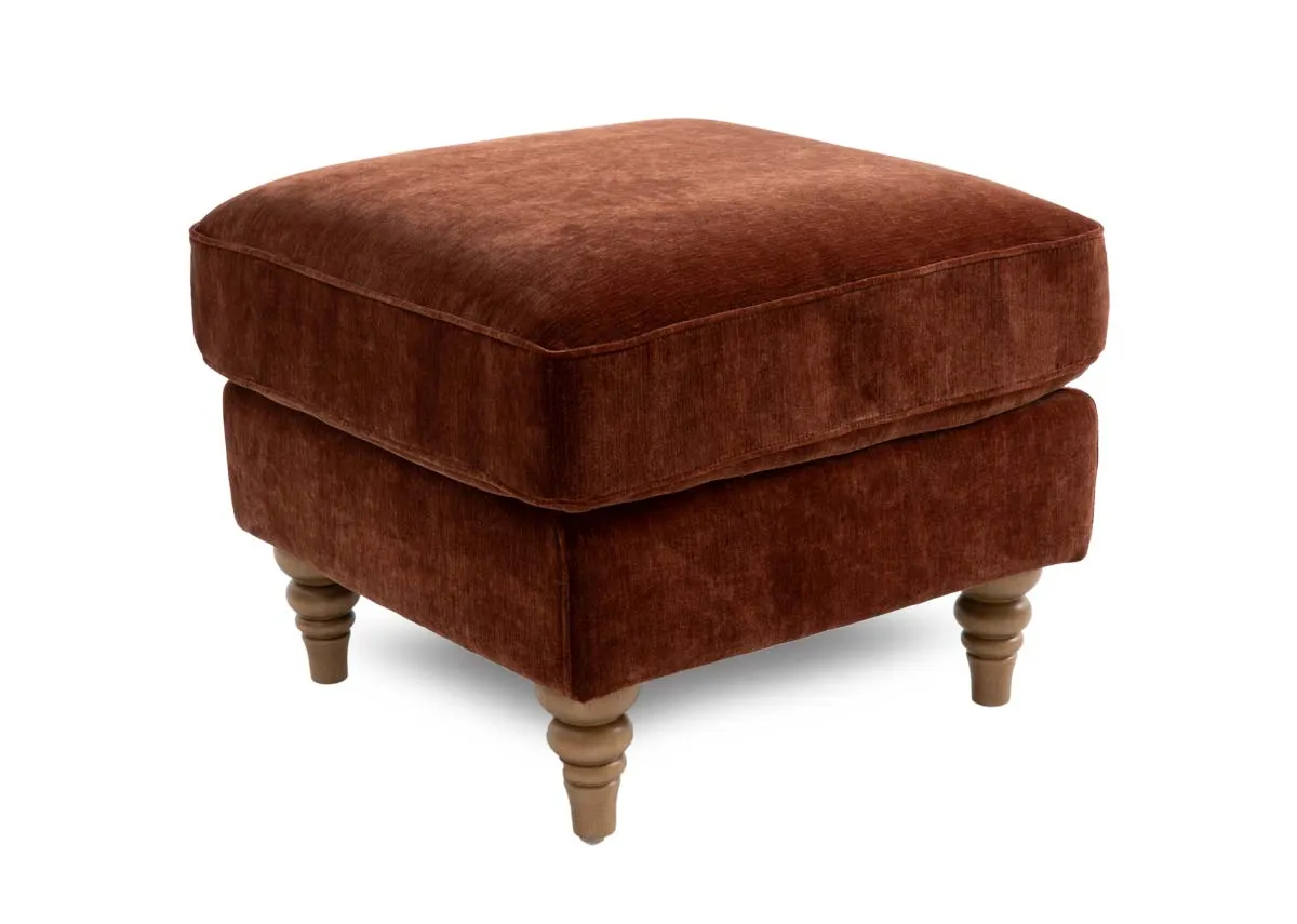 A rust fabric footstool from EZ Livings Cotswold range. Angled view