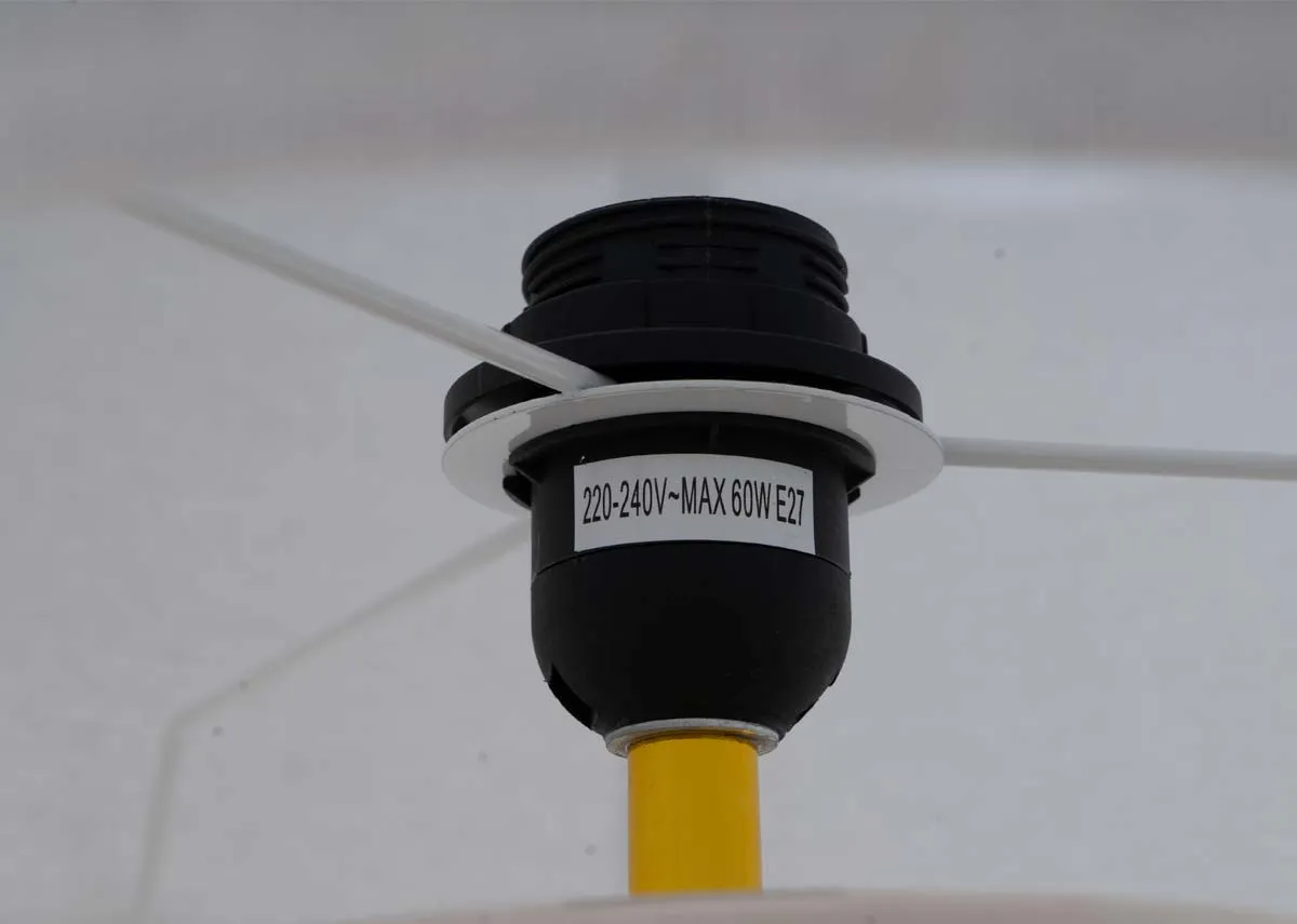 A closeup .of the bulb requirement details on the Ballndine lamp which is not included