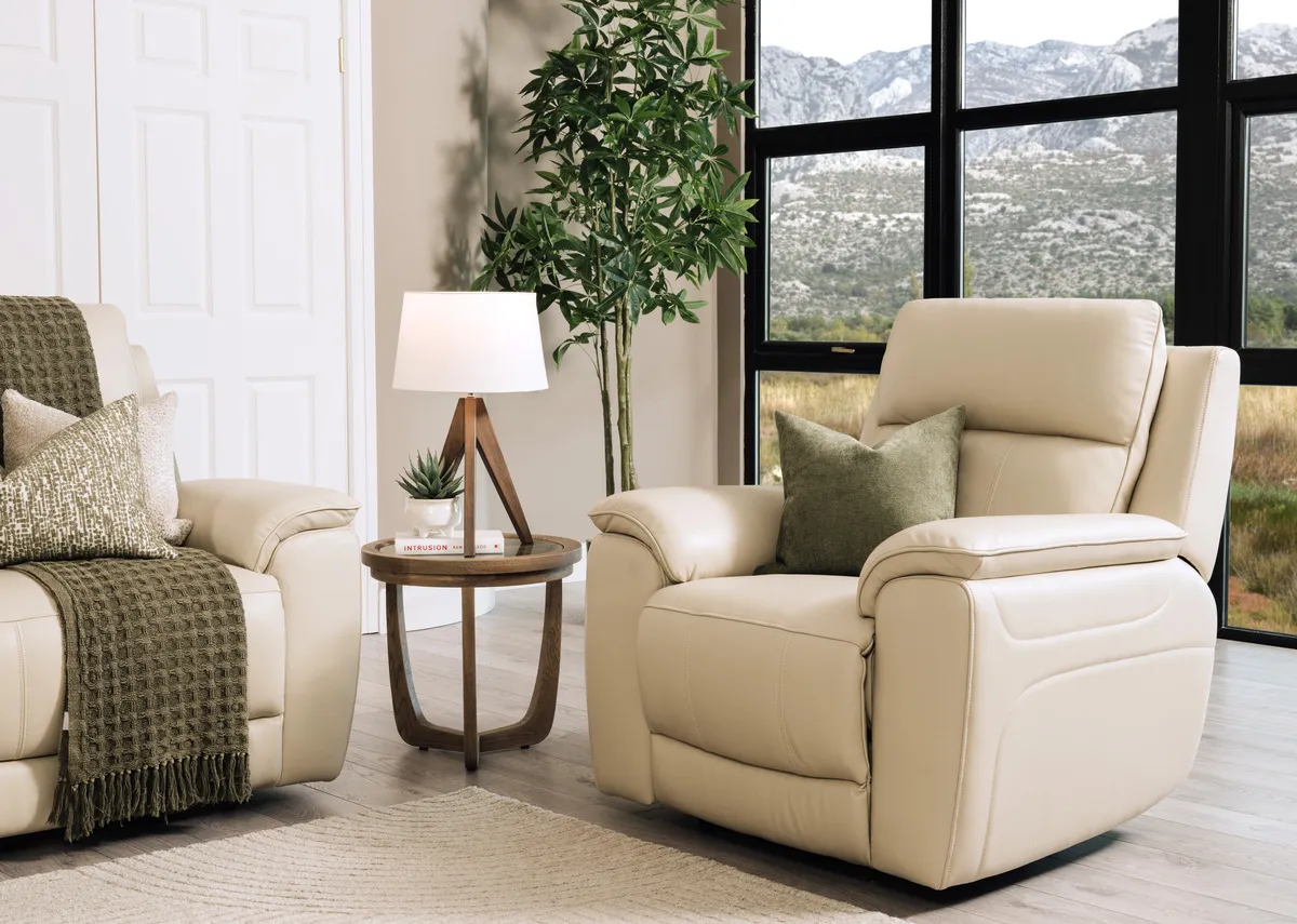 A lifestyle image of the Aura leather recliner with leg fixed with Alexis table and Glenveagh lamp