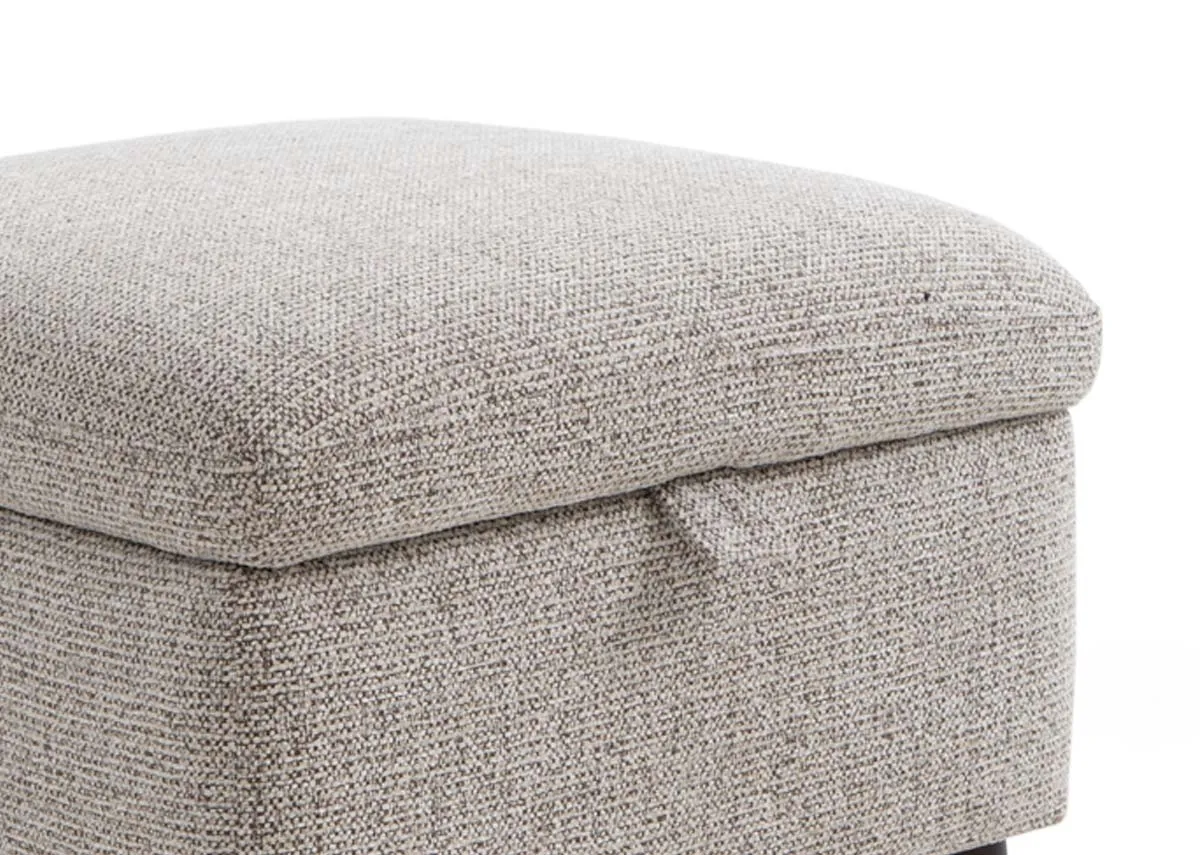 A beige fabric storage footstool from EZ Livings Savoy range. Closeup of beige fabric and tab for lifting lid